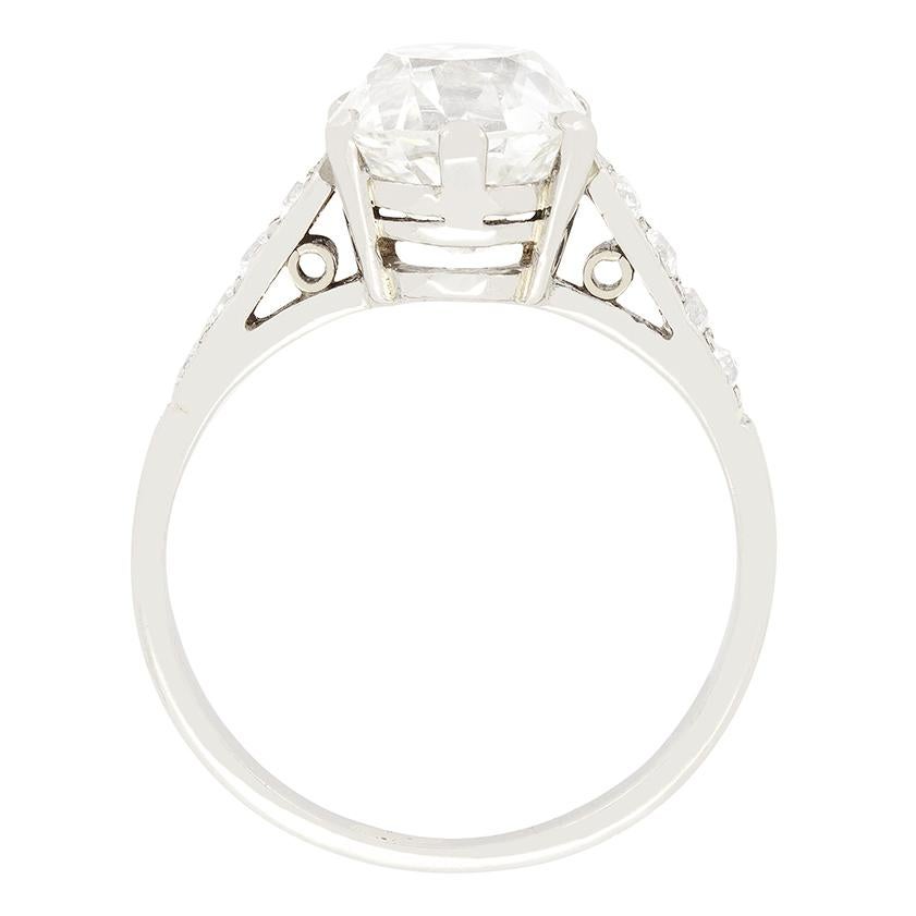 This show stopping solitaire ring features an impressive old cushion cut diamond at its centre. The 2.66 carat diamond Has been graded I-J in colour and VS2 in clarity and sits proudly set into platinum. Accenting the timeless solitaire style, each