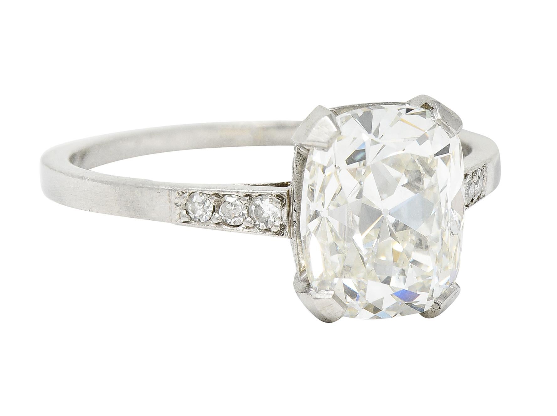 Featuring a radiant cut diamond weighing 2.60 carats - I color with SI2 clarity

Basket set by wide prongs and flanked by subtle cathedral shoulders

Accented by single cut diamonds weighing approximately 0.10 carat - eye clean and white

Tested as