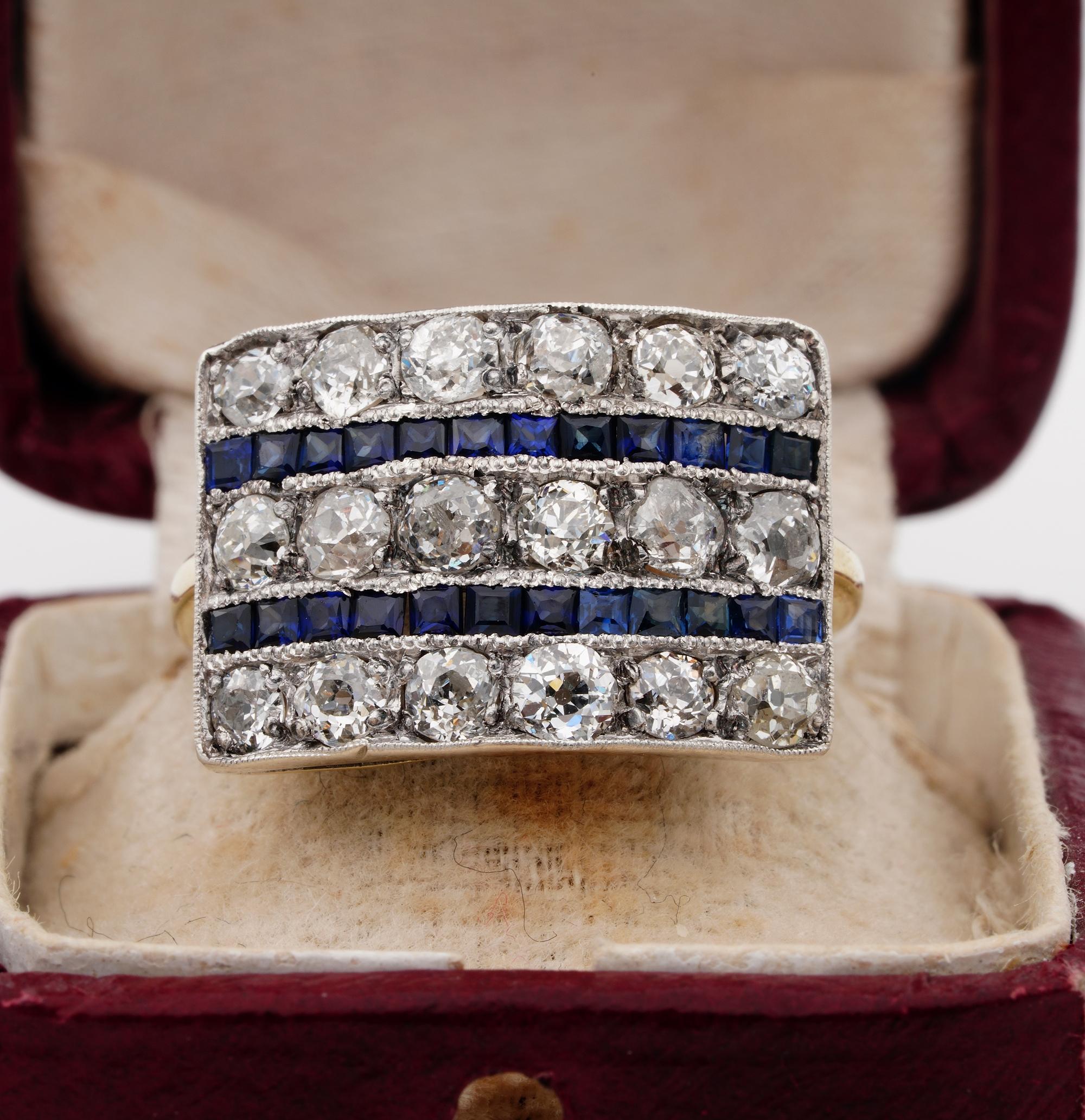 Art Deco Delight
Art Deco 1925 ca beautifully hand crafted of solid 18 KT
Wide rectangular panel ring of sleek geometric design, set with 2.70 Ct of old mine cut Diamonds H/I VVS/SI disposed into three rows, interspaced by two rows of intense Blue