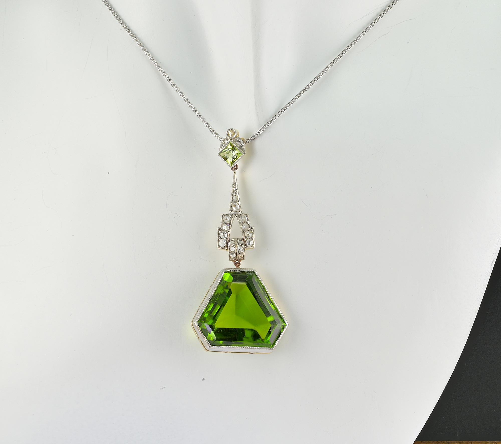 This stunning antique pendant is 1925 circa
Skillfully hand created during the Deco period of solid 18 KT gold Platinum topped
Breath taking in design expressed in elegant mixed geometries between the top articulated Diamond line and the large