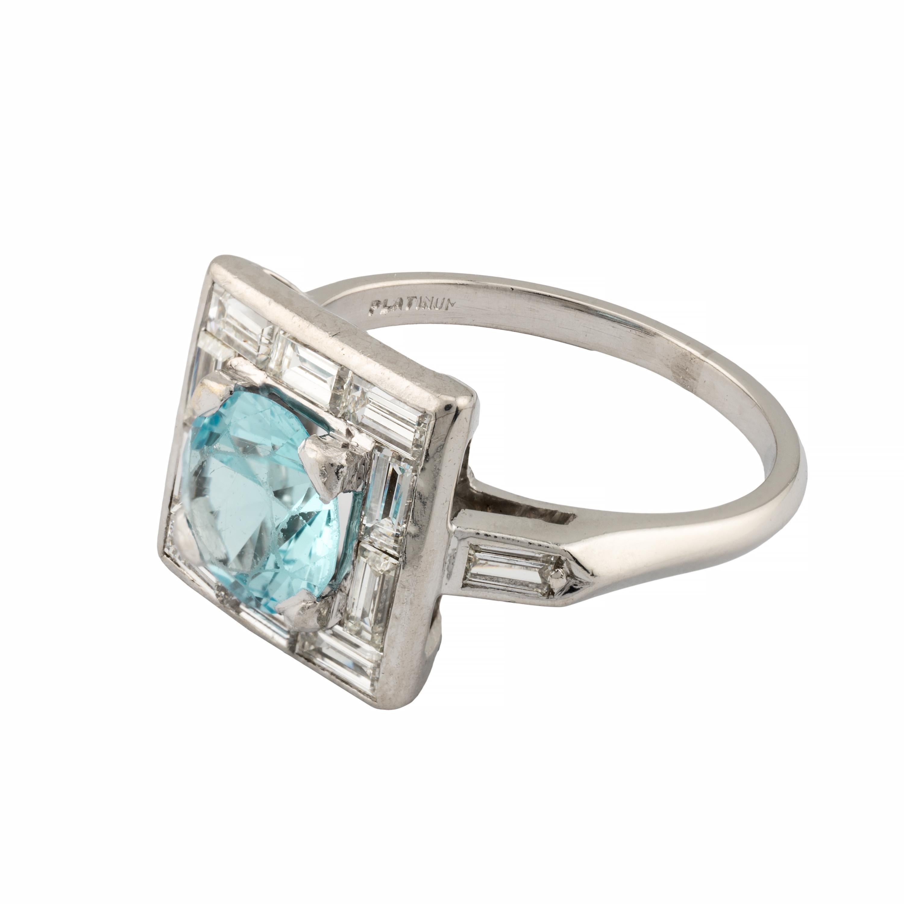 Aston Estate Jewelry Presents:

A beautiful Art Deco period blue zircon and diamond ring in platinum. Centered by a 2 carat blue zircon measuring 7mm in diameter and of beautiful vivid blue color. Framed by twelve baguette cut diamonds of 0.80ctw