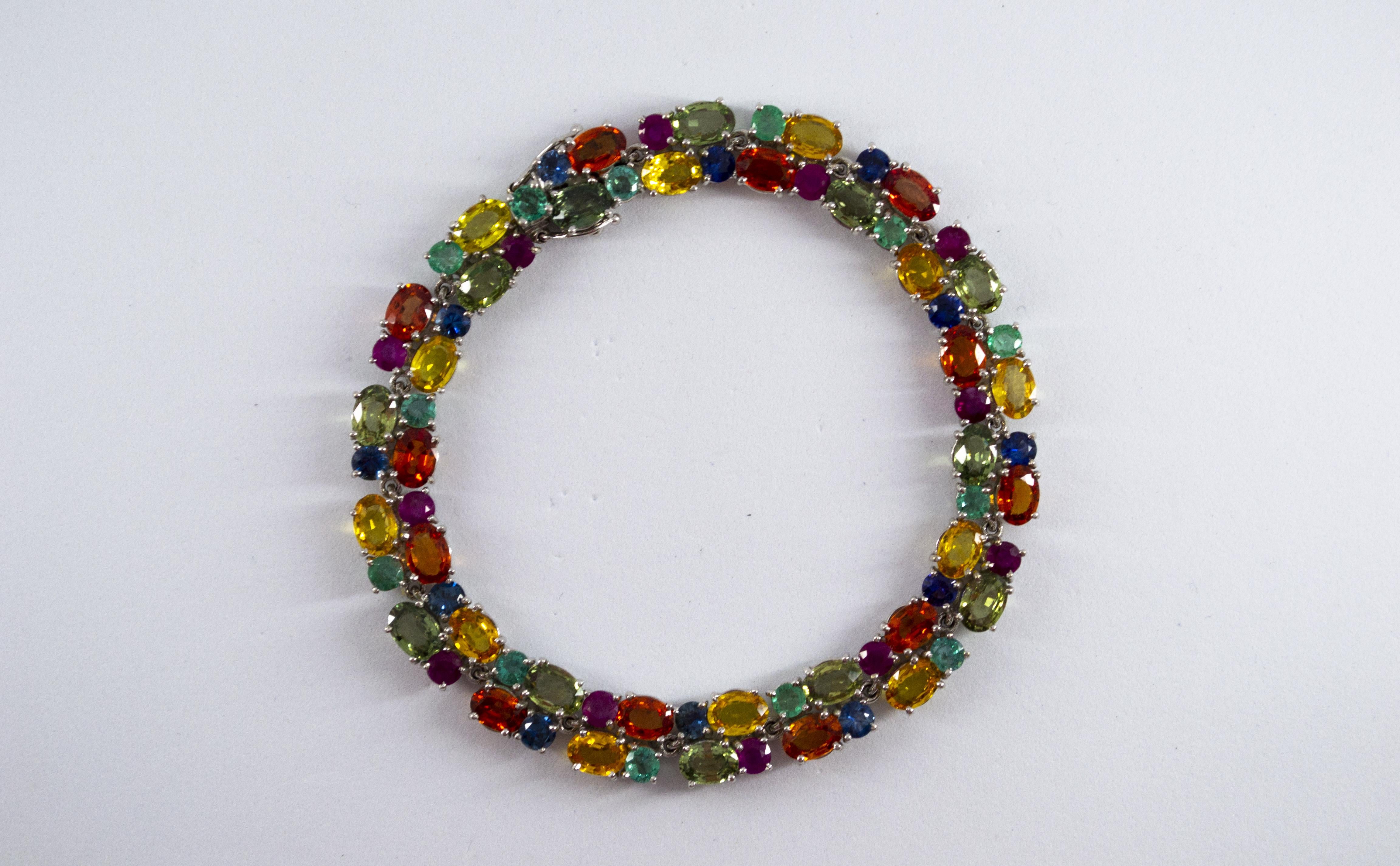 This Bracelet is made of 18K White Gold.
This Bracelet has 29.00 Carats of Rubies, Emeralds and Blue, Green and Yellow Sapphires.
This Bracelet is inspired by Art Deco.
We're a workshop so every piece is handmade, customizable and resizable.