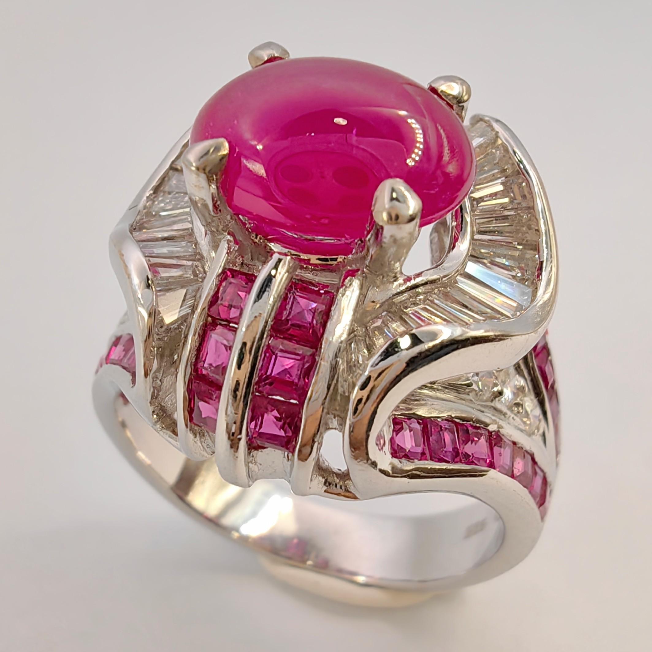 Introducing our exquisite Art Deco 2.91 Carat Cabochon Ruby Diamond Ring in 14K White Gold, a true masterpiece that effortlessly blends vintage charm with modern elegance.

At the heart of this captivating ring lies a magnificent oval cabochon ruby,