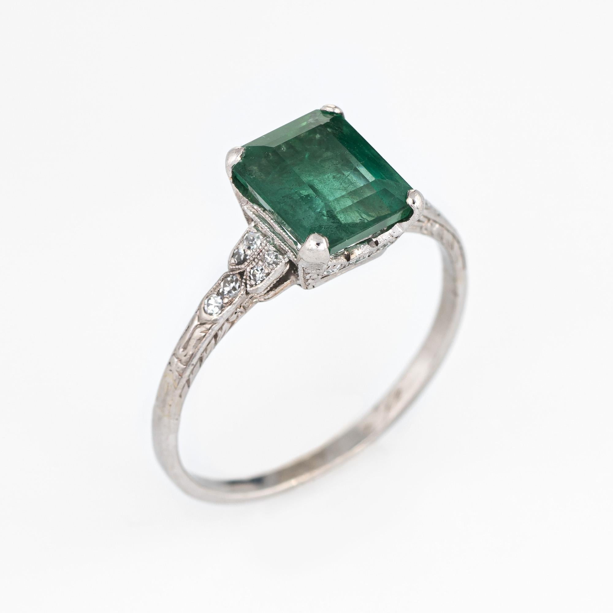 Stylish vintage Art Deco era 2ct emerald & diamond gemstone engagement ring (circa 1920s to 1930s) crafted in platinum. 

Emerald cut natural emerald measures 8.44 x 6.93 x 4.64 (estimated at 2 carats) is accented with 12 single cut diamonds