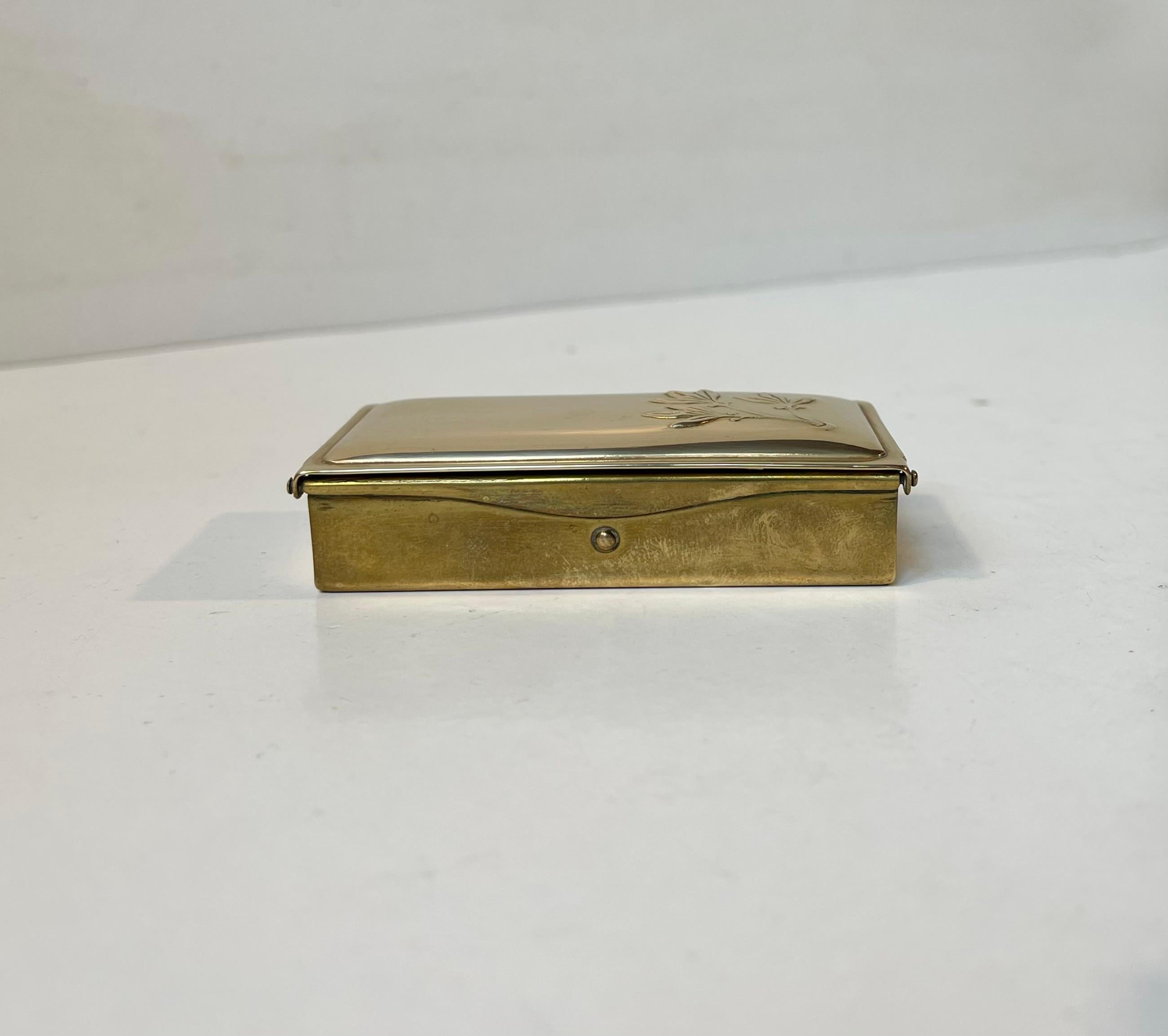 Practical 3 compartment stamp or pill box in brass. Beautifully finished and ingenious mechanism. Made in Scandinavia or England during the 1920s or 30s. Measurements: 8x4,5x2 cm.

Free World wide express shipping.