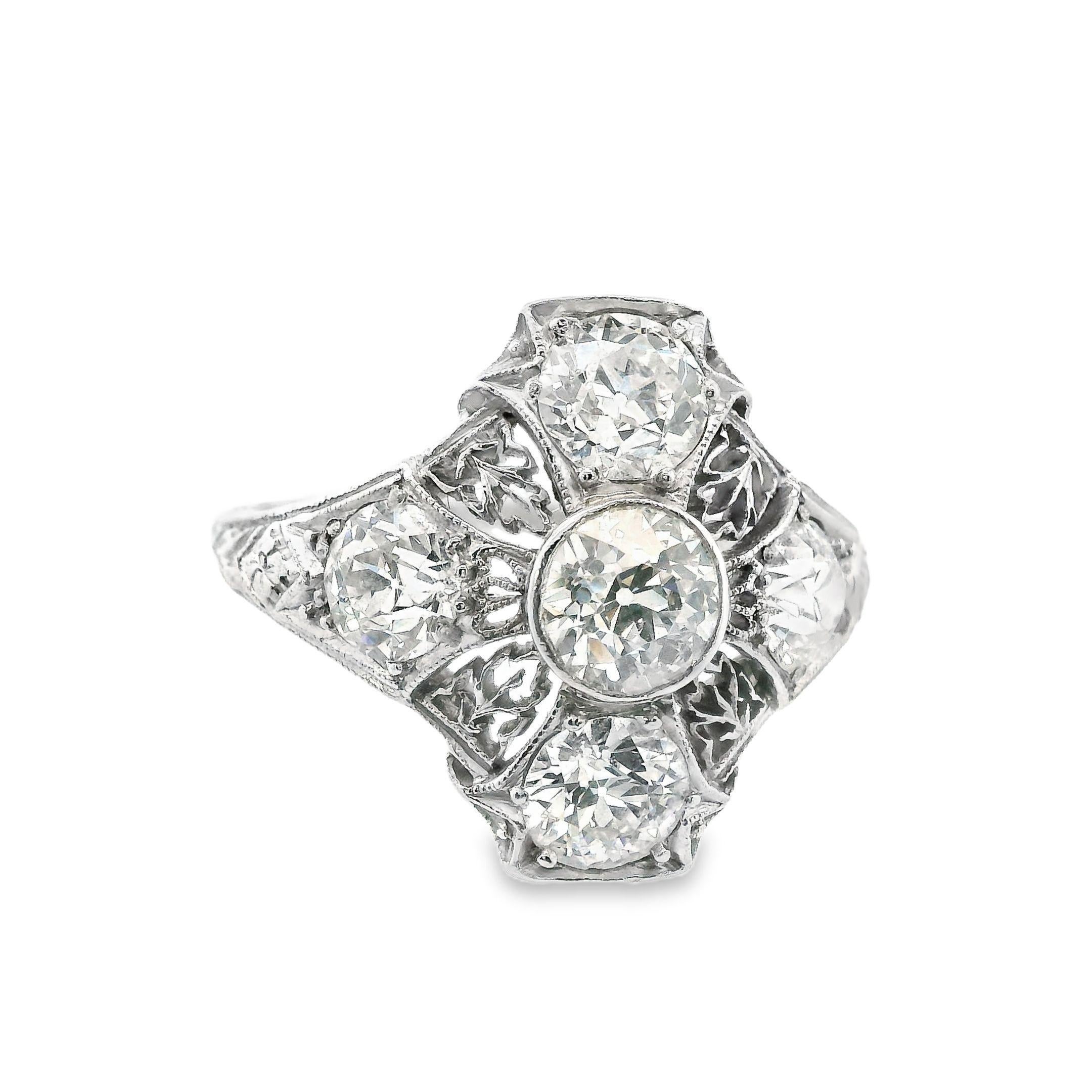 This diamond ring, made in platinum, comes from the Art Deco period and features fine filigree and engravings. The ring features a total of 5 matching, bright white, European cut diamonds that all match; a center diamond with 4 diamonds around it.