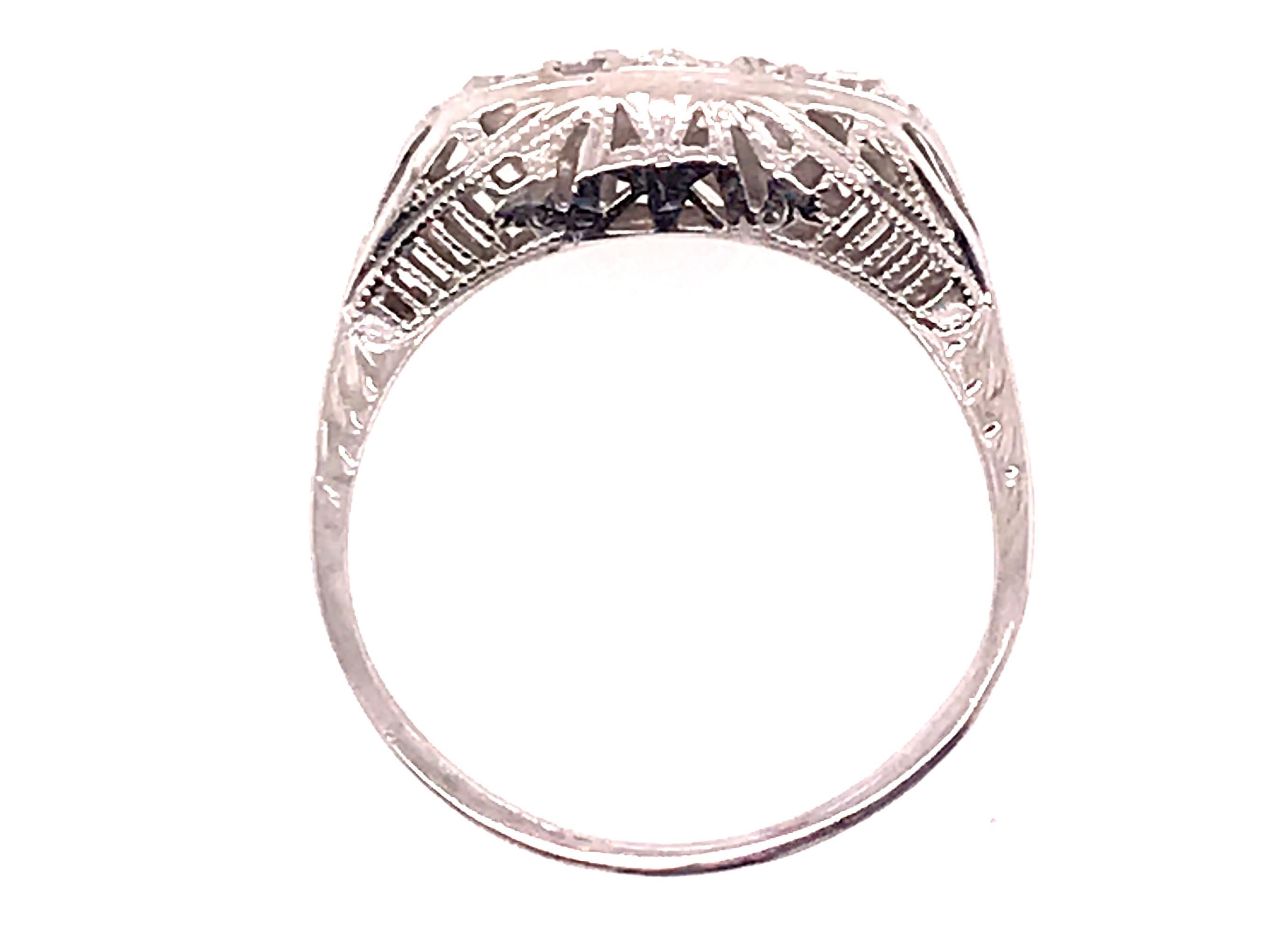 Genuine Original Antique from 1920's-1930's Vintage 3 Stone Diamond Cocktail Filigree Ring .25ct 18K Art Deco 


Features 3 Genuine Antique Old European Cut Center Diamonds

Antique Vintage Style with Elegance 

Beautiful Hand Carved Filigree and
