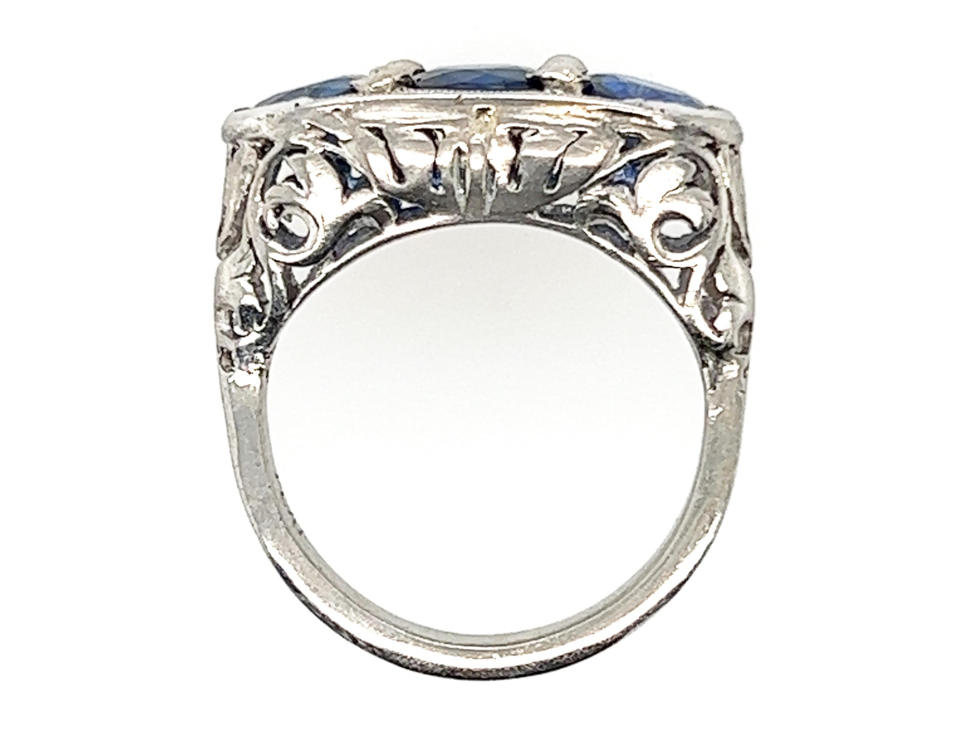 Genuine Original Art Deco Antique from 1920's 3 Stone Sapphire Ring 3.51ct Round Cut Platinum  


Features Three Natural Round Cut Vibrant Blue Sapphire Gemstones 

Hand Engraved Tulips Line Each Side  

100% Natural Gemstones 

3.51 Carat Total