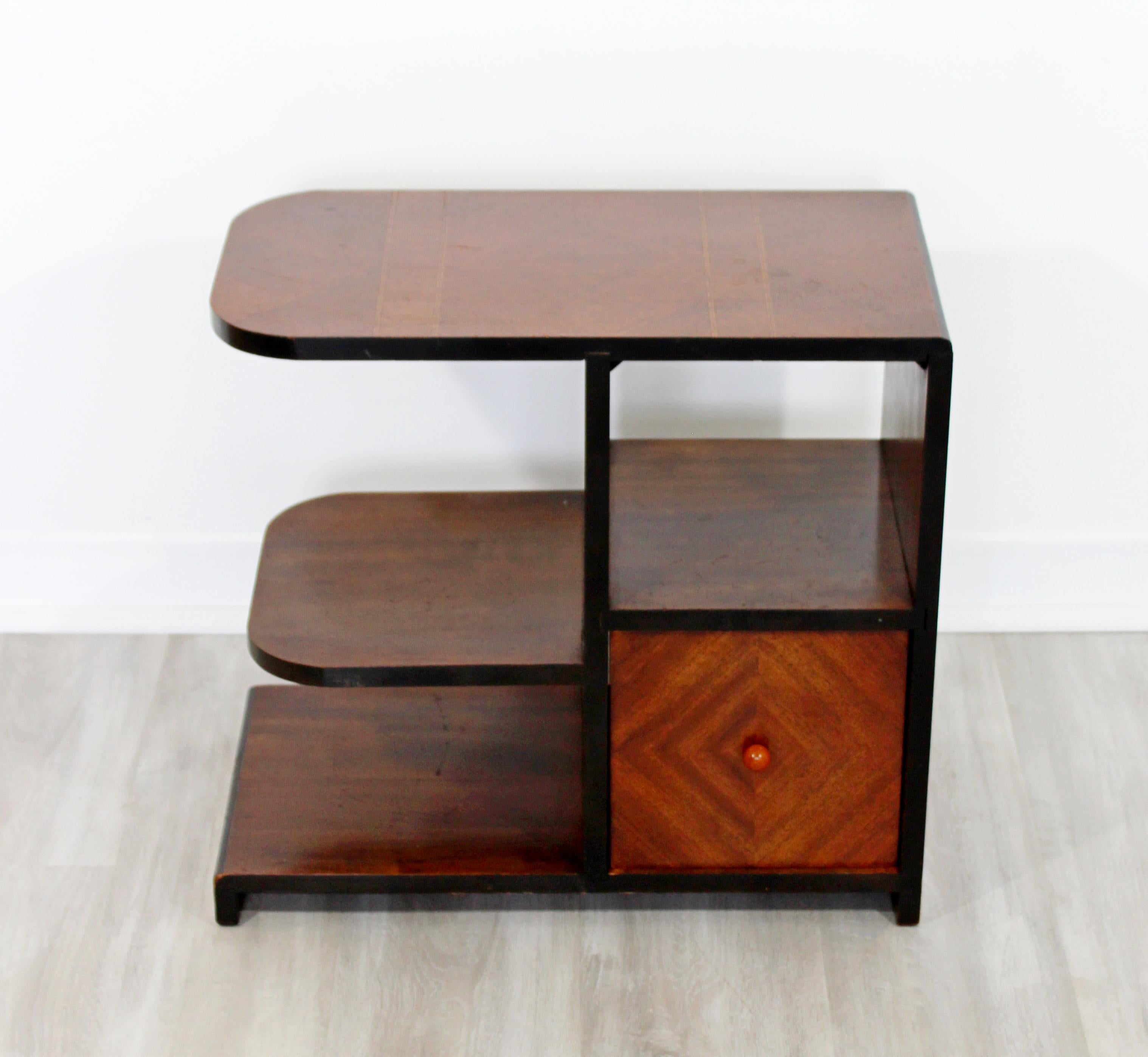 For your consideration is a fantastic mahogany three tiered side or end table, with a removable drawer, in the style of Donald Desky, Gilbert Rohde or Paul Frankl. In very good condition. The dimensions are 21.5