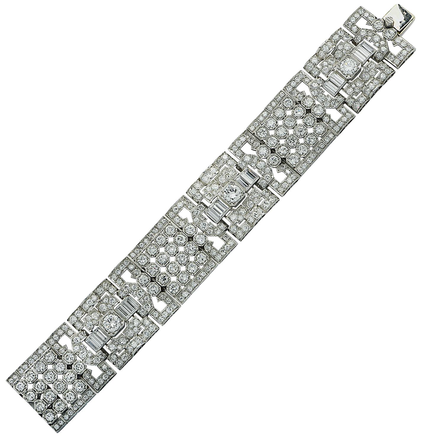 Exquisite Art Deco bangle bracelet crafted in platinum featuring Old European Cut and Baguette Cut diamonds weighing approximately 30 carats total, H color, VS-SI clarity. This gorgeous open metal bracelet features ornate motifs showcasing a center