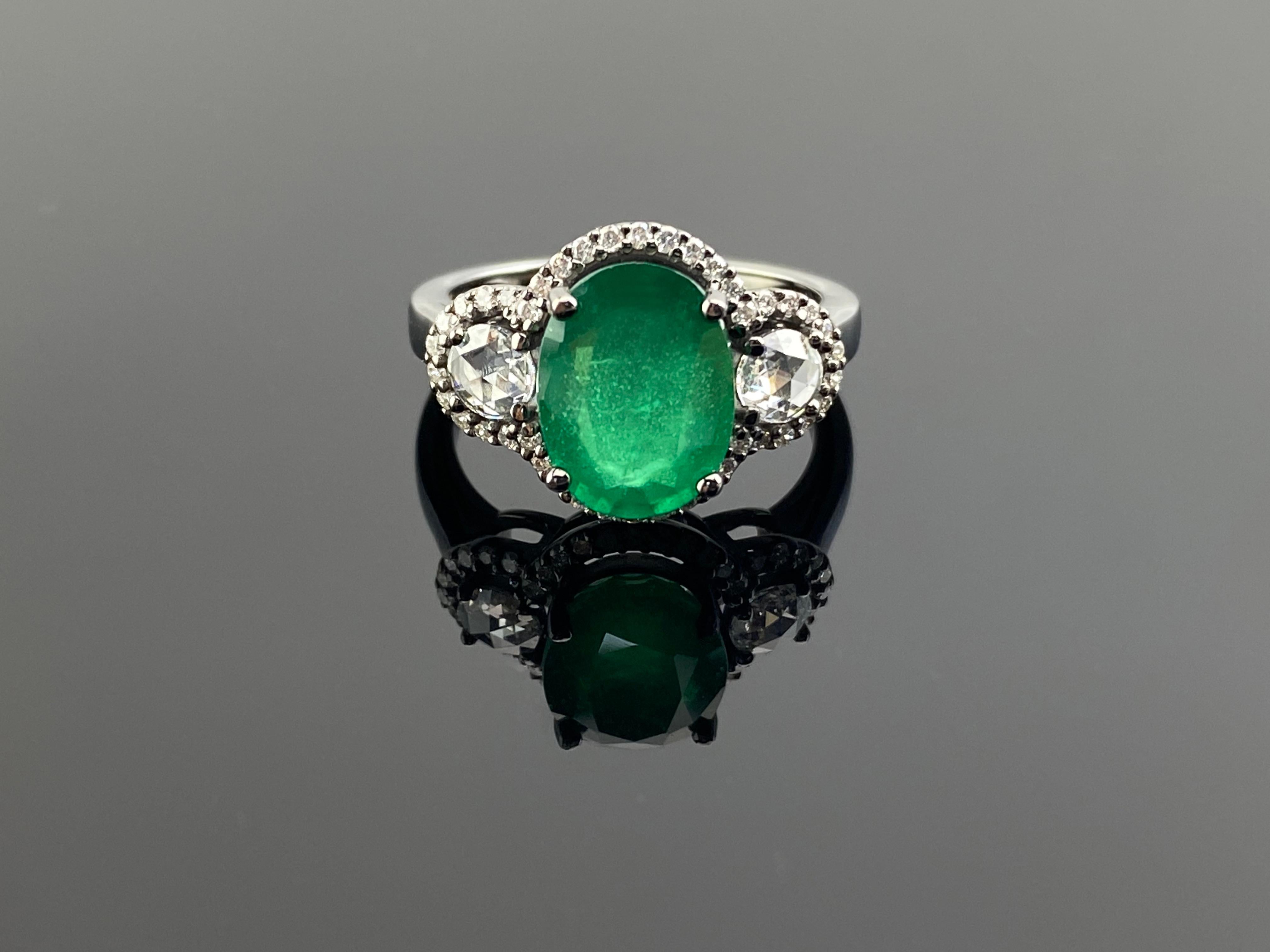 Art Deco Style 3.01 Ctw Fine Quality Oval Zambian Emerald & Rosecut Diamond  French Pave Ring in 18k Rhodium polished Gold

Add the influence of the Art Deco Era to your fine jewelry collection with this one-of-a-kind 18k gold ring, reimagined for