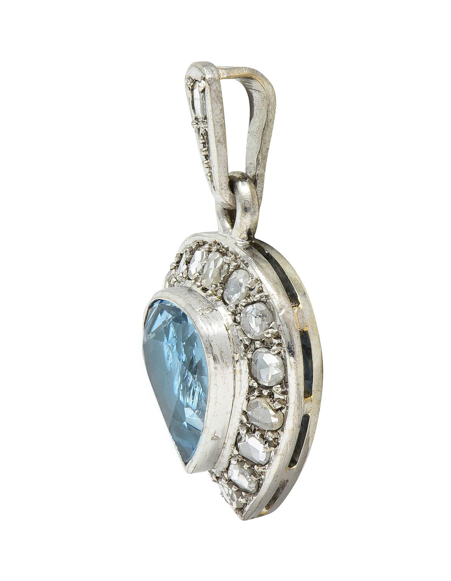 Designed as a white gold heart shaped pendant suspending from a granulated bale
Centering a heart cut aquamarine weighing approximately 2.28 carats total
Transparent light blue in color and bezel set with a halo surround
Comprised of rose cut