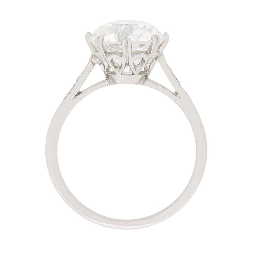 Dating to the 1930s this stunning engagement ring is a timeless solitaire design. The claw set diamond weighs 3.18 carat and has a certificate from HRD. They have graded the stone as a J in colour and an SI1 in clarity. The beautiful collet has a