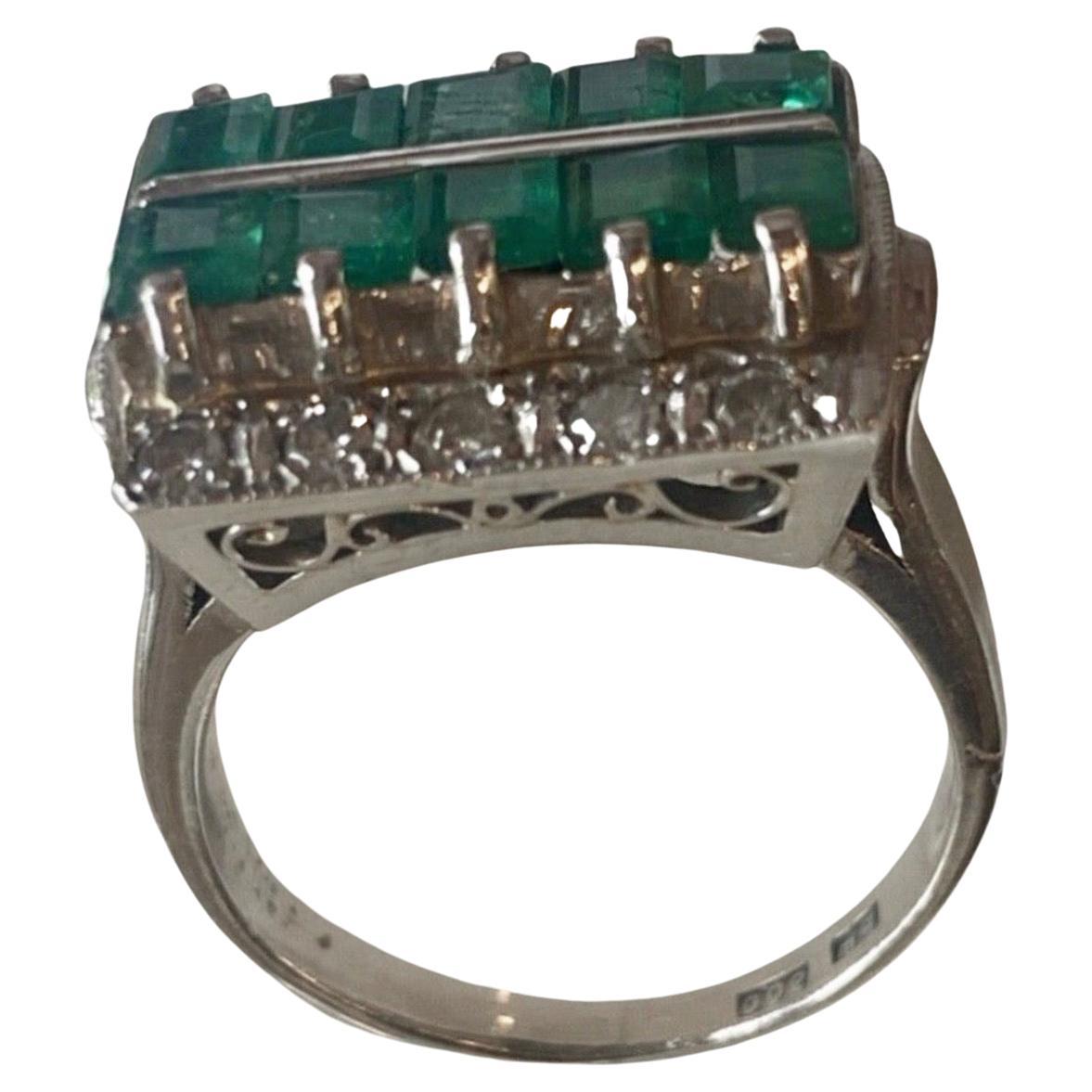 Antique Art Deco 3.50 Carats Emerald and Diamond Platinum Engagement Ring. 
The center features ten Asscher Cut-shaped emeralds, totaling 3.00 carats. Right below the stones, there are twelve round single-cut diamonds that enhance the sparkle and
