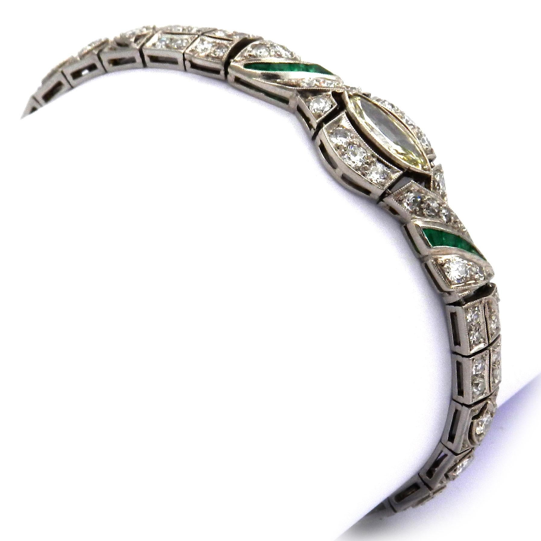 Art Deco 3.51 ct Diamond Emerald Platinum Bracelet circa 1920

Elegant bracelet made of geometric links, centrally set with a diamond navette weighing 0.6 ct, framed by diamonds and calibrated emerald squares and completely set with 72 radiant