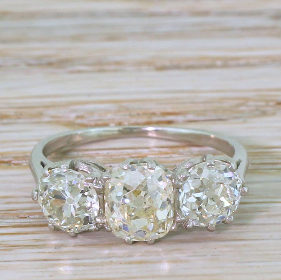 An absolutely wonderful vintage diamond trilogy ring. The trio of diamonds each tip the scales at over a carat (1.02, 1.04 and 1.48 carat respectively) and are loaded with life, fire and brilliance. The stones are secured in a wonderfully stripped