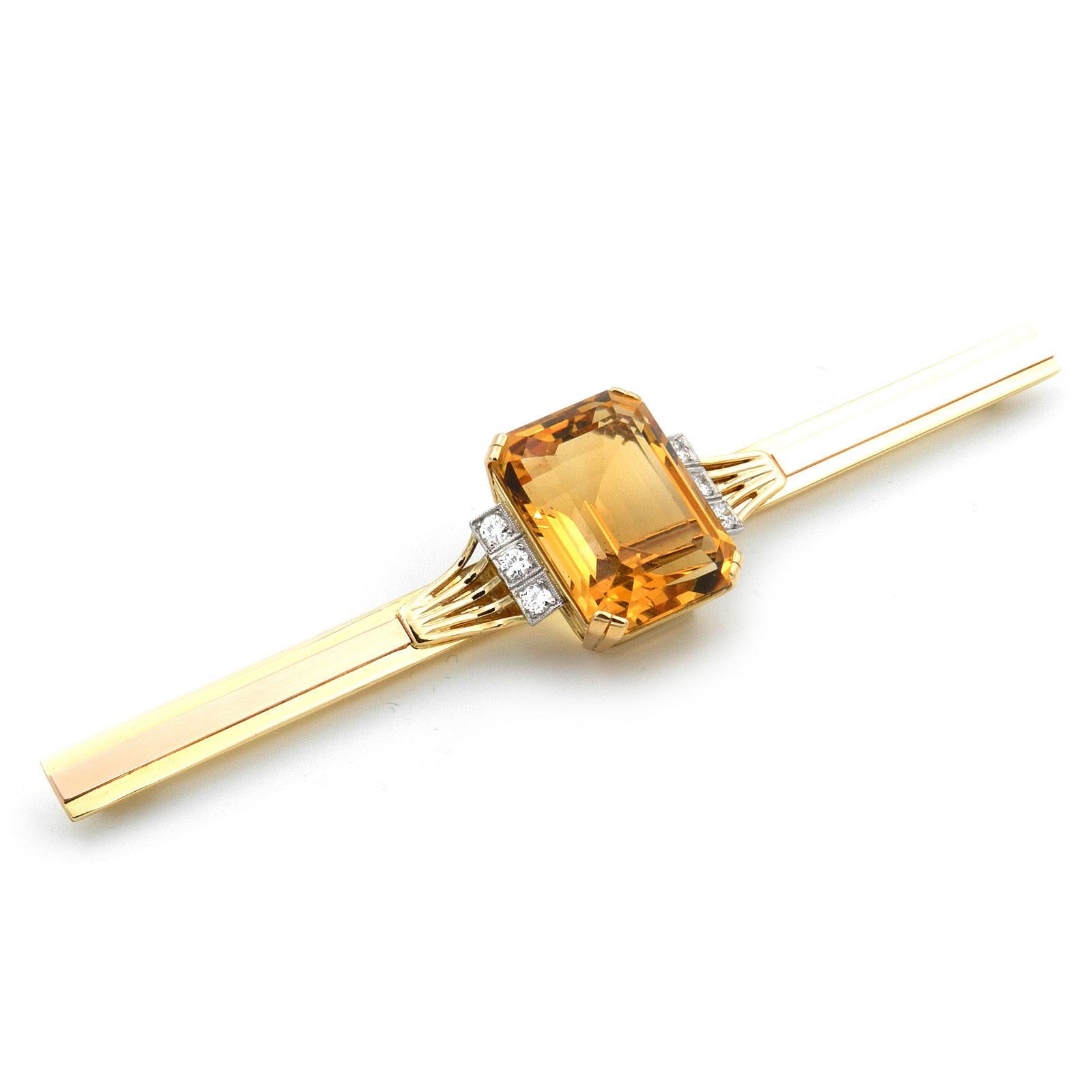 Art Deco 37 Carat Citrine Diamond Gold Bar Brooch, circa 1930

This nearly 5 inch extra-long bar brooch is made of yellow and red gold, the front side accentuated with a strip of red gold and decorated with delicate gold wires, centrally set with a