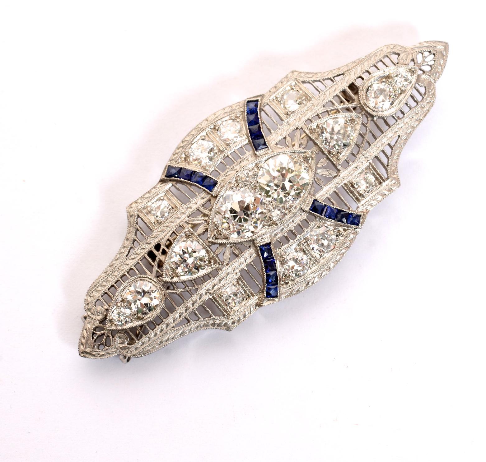 Art Deco 3.75 Carat Diamond and Sapphire, Brooch/Pendant, in a Platinum Filigree Setting. The brooch has 16 diamonds, total weight approximately 3.75 carats and 16 square French cut sapphires weighing approximately .32 carats. The brooch has a