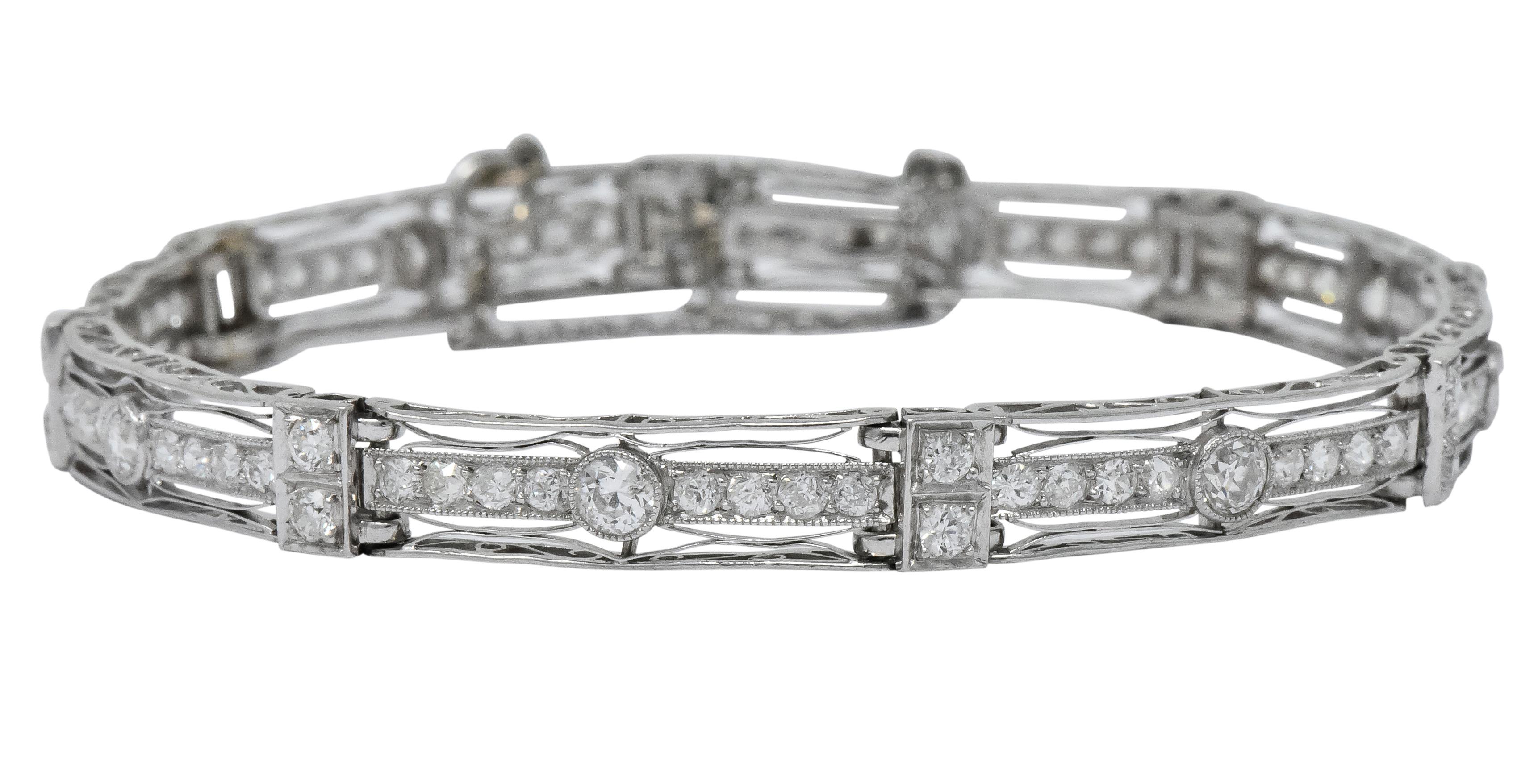 Featuring pierced millegeain wire-work frames with an old European cut diamond center flanked by smaller old European cut diamonds

Spacer links also contain old European cut diamonds

Total diamond weight approximately 3.85 carats, GHI color and VS