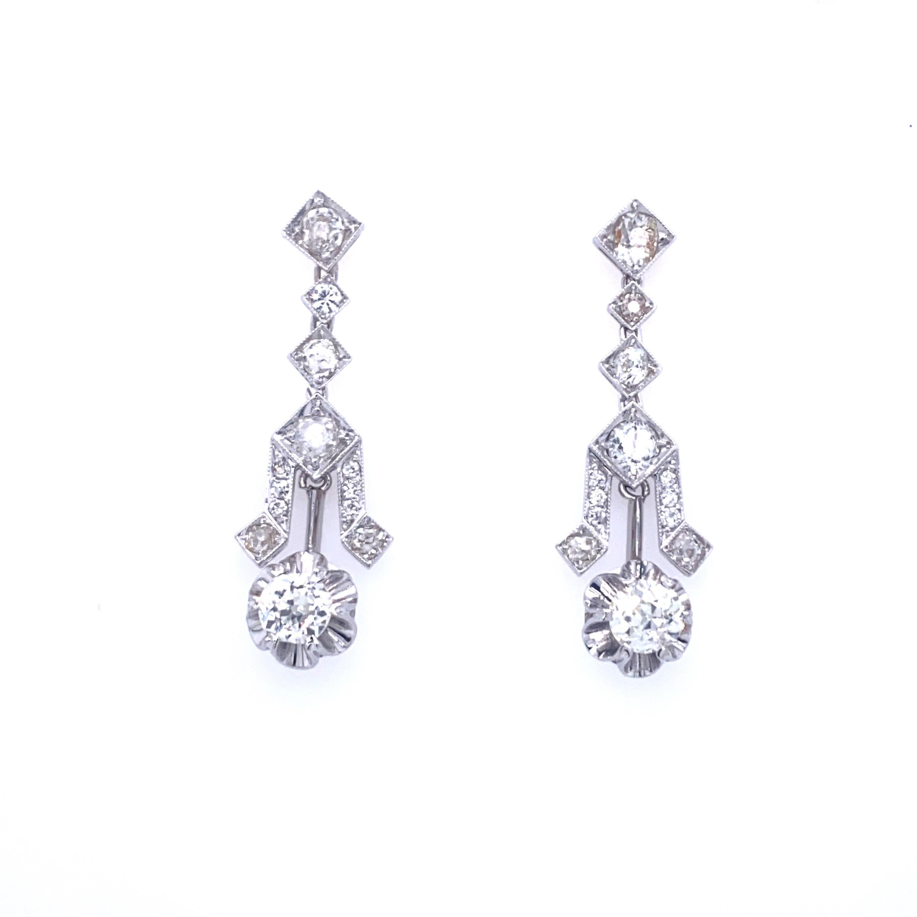 Timeless pair of diamond 18k white gold drop earrings feature sparkling old mine cut diamonds that weigh approximately 4.00ct. total, graded G/H/I color with VS clarity. Authentic Art Deco Circa 1930

CONDITION: Pre-owned - Excellent 
METAL: 18k