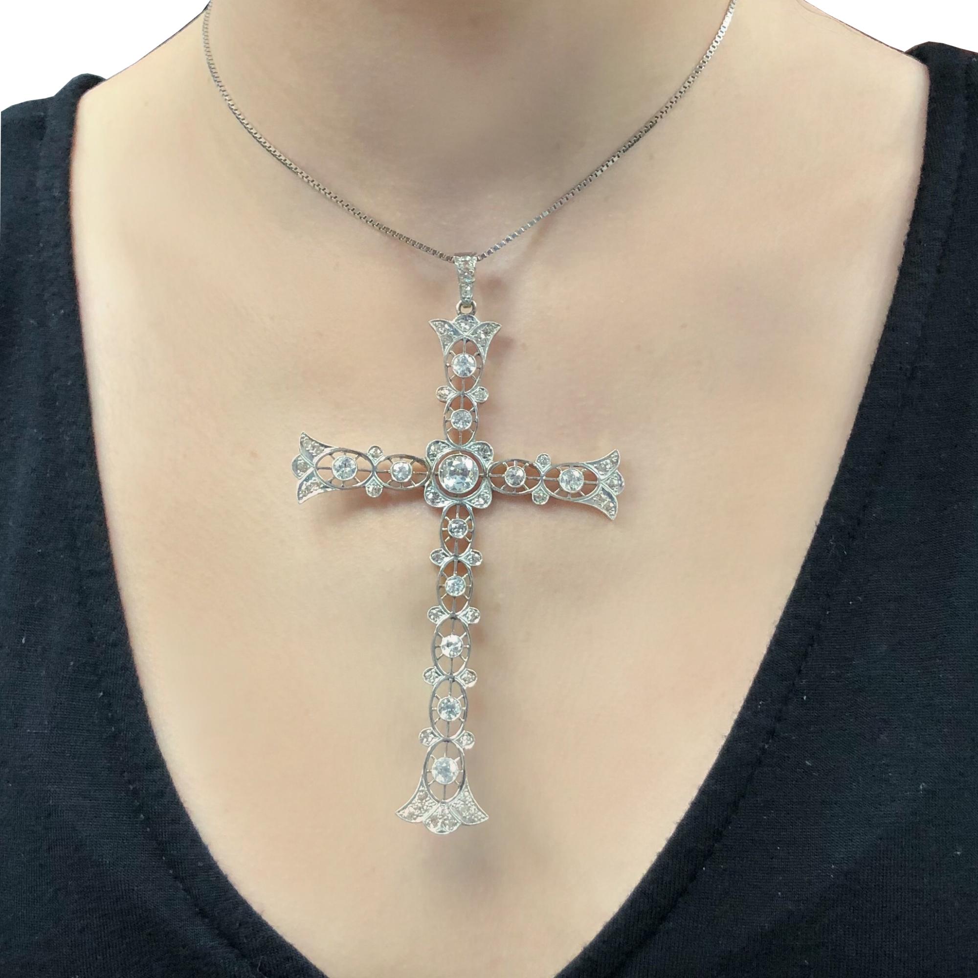Beautiful art deco large cross pendant crafted in Platinum over 18 karat yellow gold, featuring a gorgeous Old Miner cut diamond weighing approximately 1 carat, and further embellished with 57 Old European cut diamonds weighing approximately 3