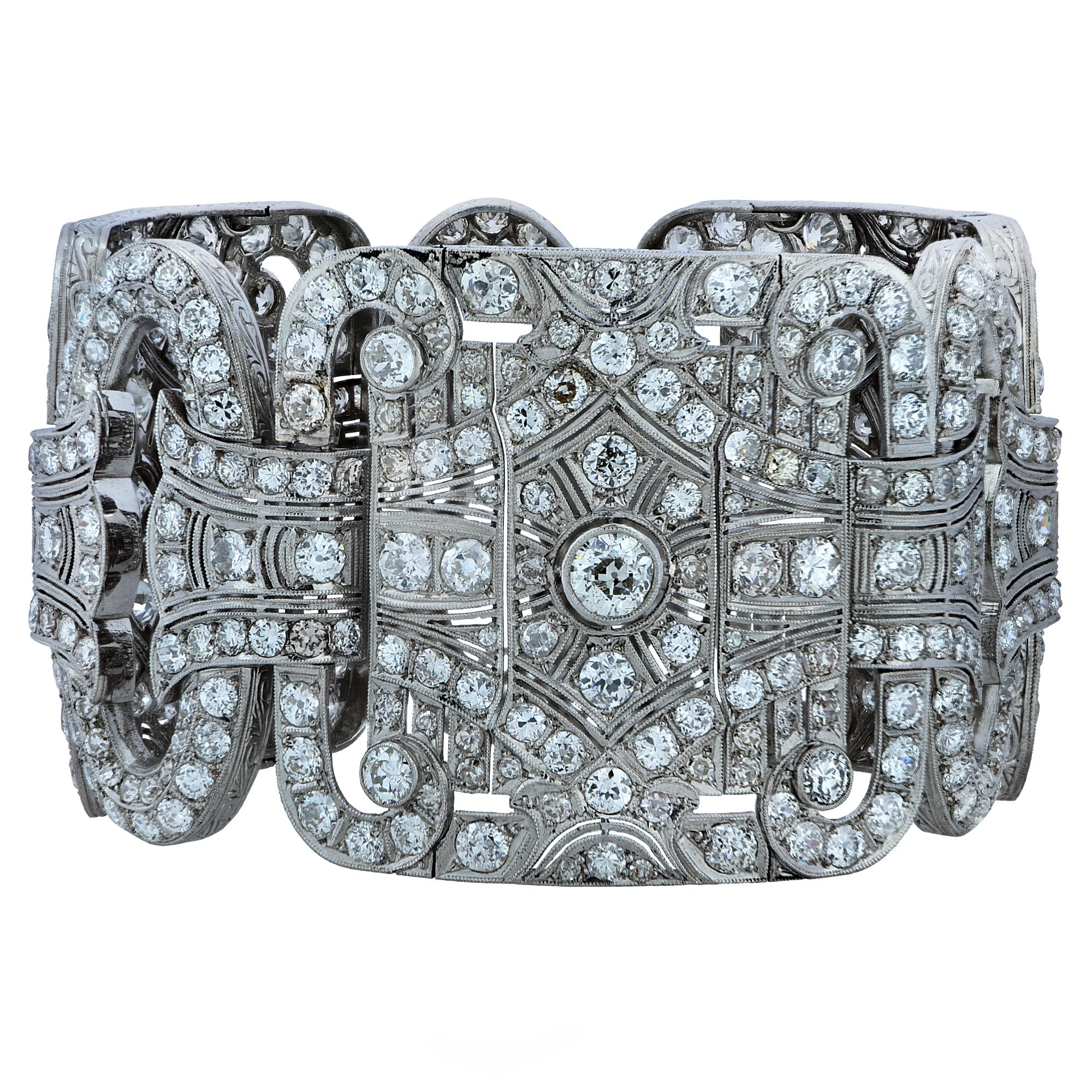 Spectacular Art Deco bracelet intricately hand crafted in platinum featuring 501 European cut and single cut diamonds weighing approximately 40 carats total, F-H color, SI1-I1 clarity. intricately set with millgrain. This sensational bold statement