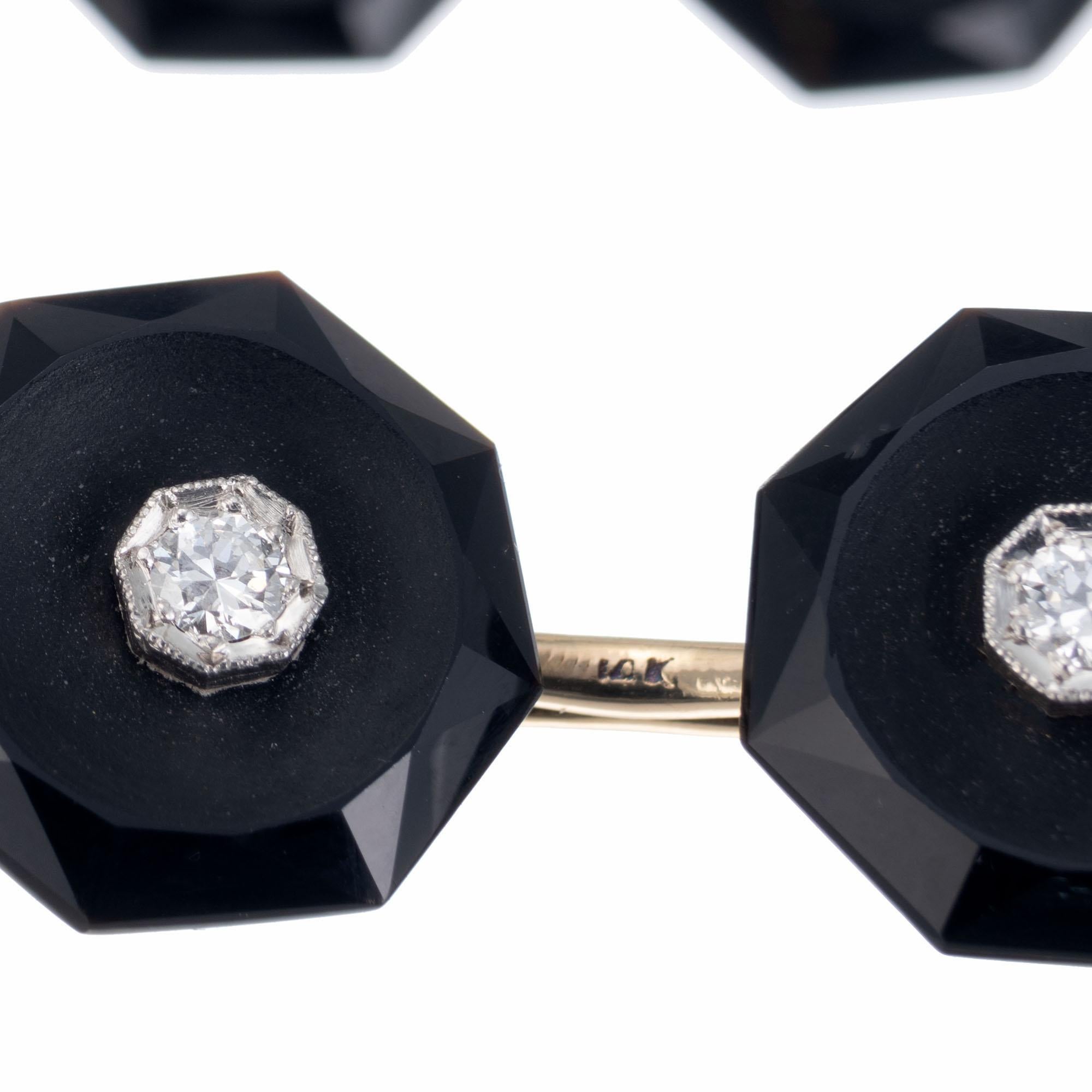 Art Deco Two double sided cufflinks and four shirt stud set circa 1920's. Black onyx octagons with 14k white gold diamond centers. 14k Yellow gold backs. Slight nick to the onyx on one shirt stud 

8 octagonal facet onyx 
8 round brilliant cut
