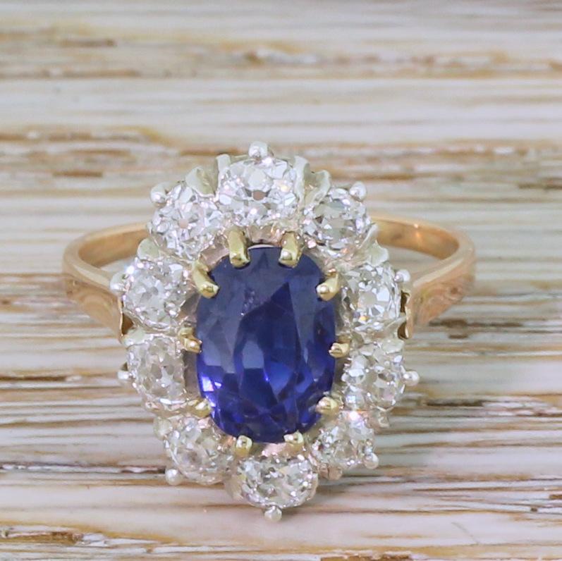 Just about the ideal blue is on show in this Ceylon sapphire ring. The rich, electric blue sapphire – certified as natural and unheated – is surround by ten chunky, white and internally clean old mine cut diamonds in a white gold coronet setting