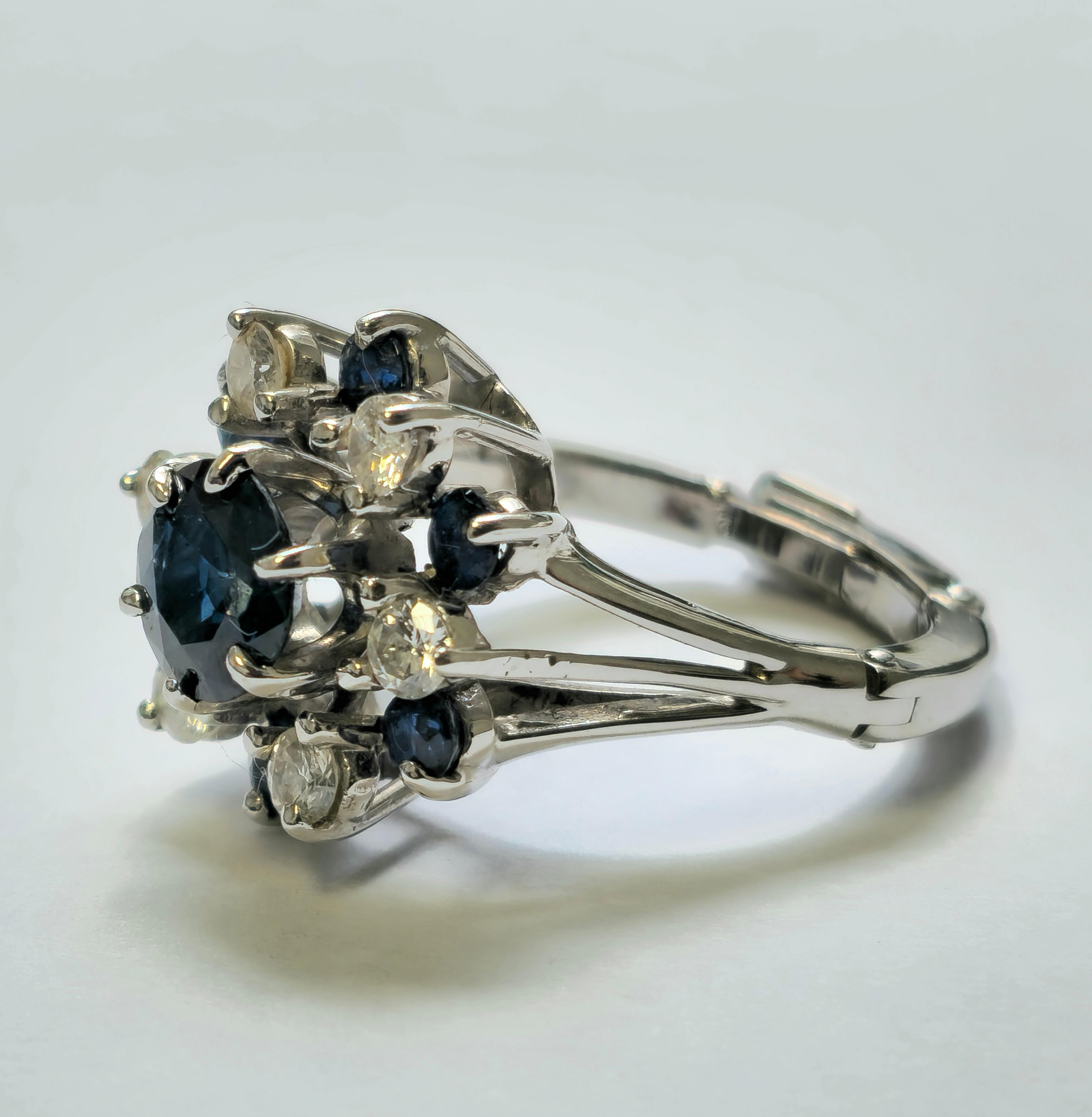Crafted from luxurious 14k white gold, this exquisite ring features a mesmerizing 2.50 carat round blue sapphire at its center, securely set in a prong setting for maximum brilliance. Flanking the center stone are additional blue sapphires totaling