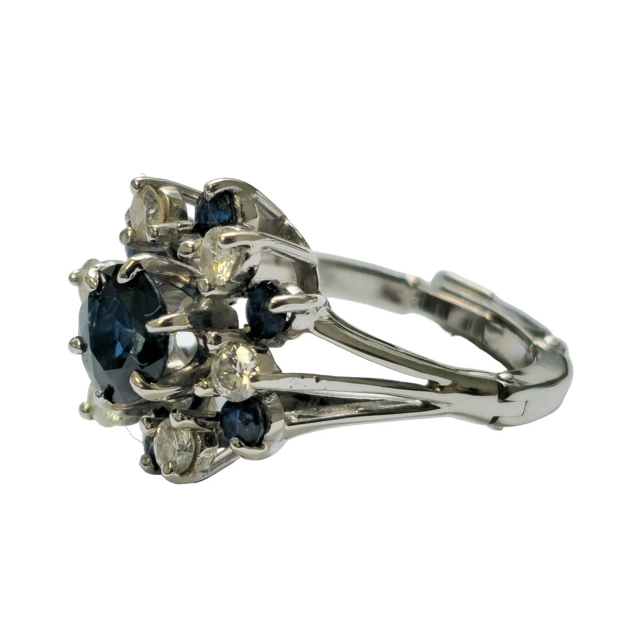 Crafted from luxurious 14k white gold, this exquisite ring features a mesmerizing 2.50 carat round blue sapphire at its center, securely set in a prong setting for maximum brilliance. Flanking the center stone are additional blue sapphires totaling