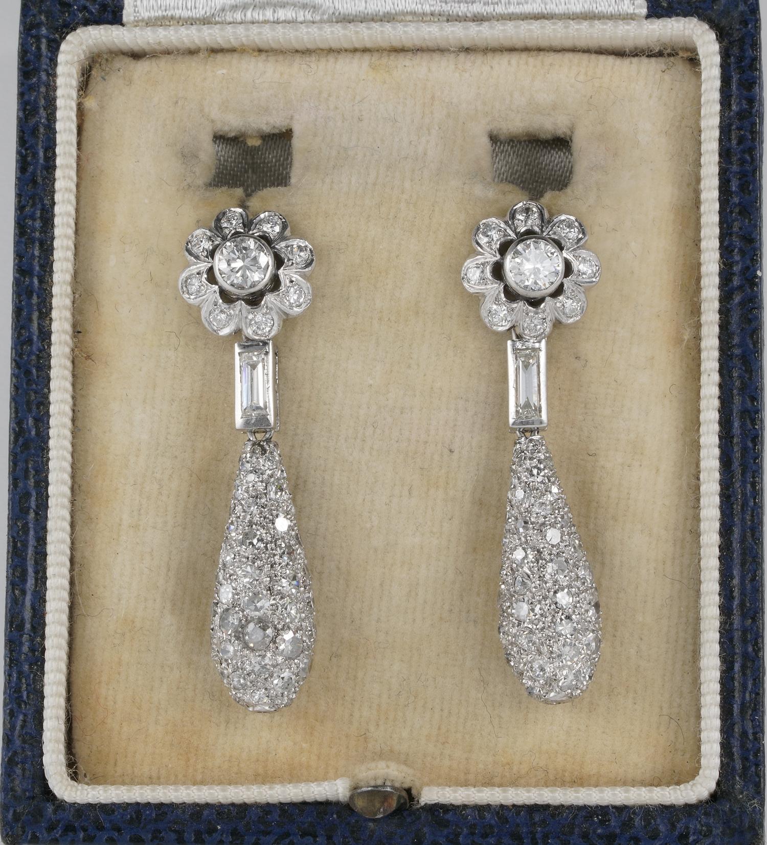 Art Deco Daisy top with swinging drop Diamond earrings
Superbly hand during 1920 of solid Platinum
Amazing workmanship between crafting and stone setting
Richly set with old cut Diamonds set throughout from top to the entire drop pendant
Diamonds