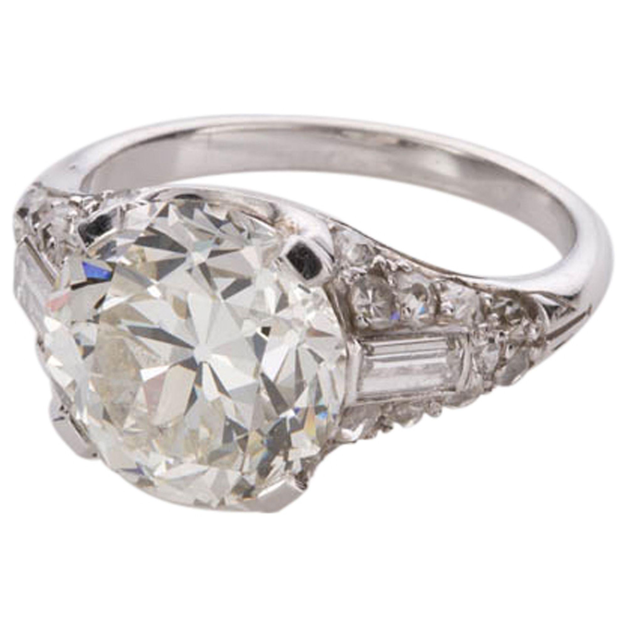 Are you looking for the perfect engagement ring or maybe a ring to celebrate a special milestone in your life. 
This original Art Deco 1920's ring is set with a central 4.21ct old European cut diamond, having all the charm of the Deco period yet