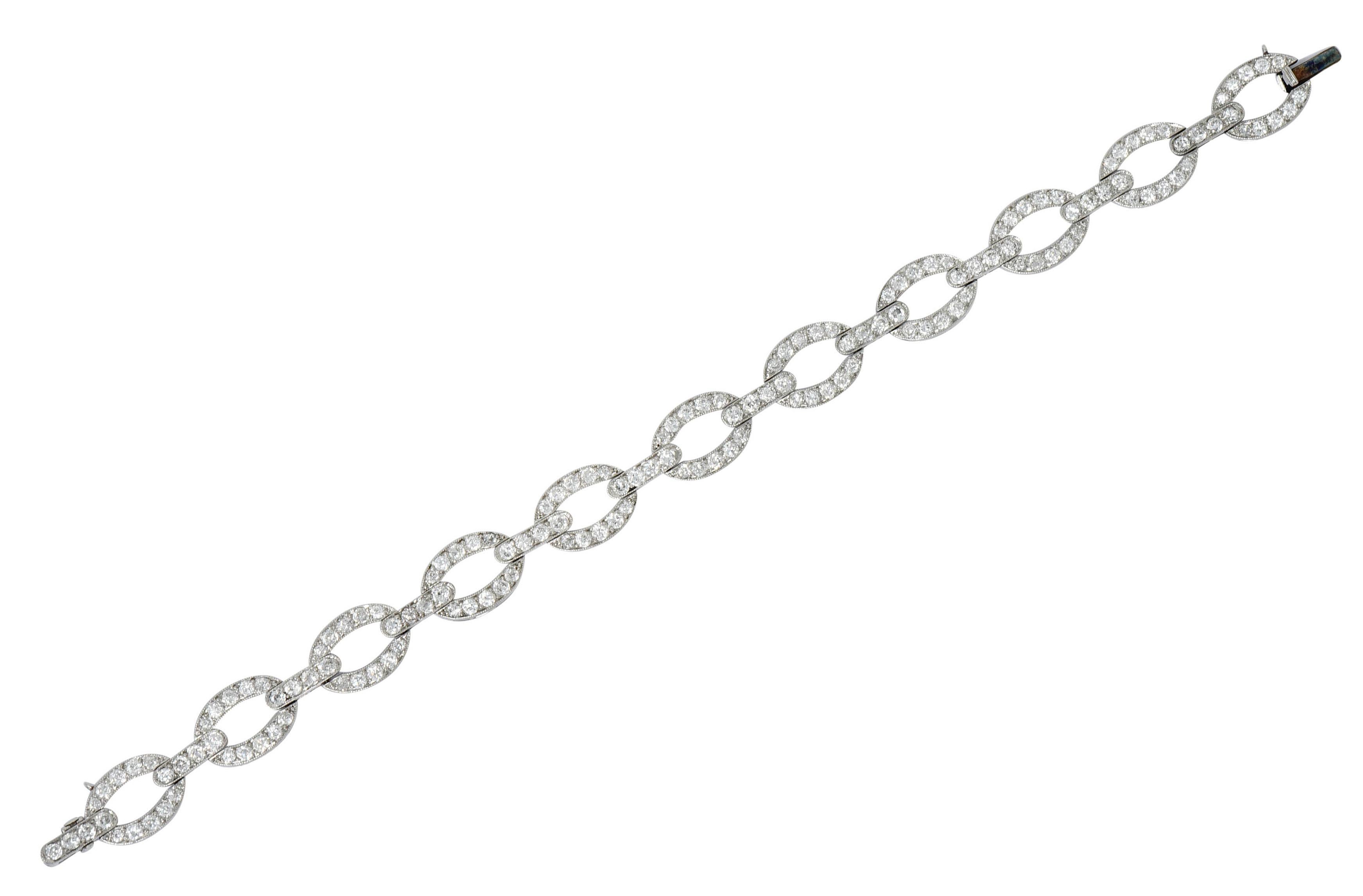 Bracelet is comprised of oval links alternating with bar spacer links

Accented by milgrain and bead set throughout by transitional cut diamonds

Weighing in total approximately 4.25 carats with G to J color and SI clarity

Completed by a concealed
