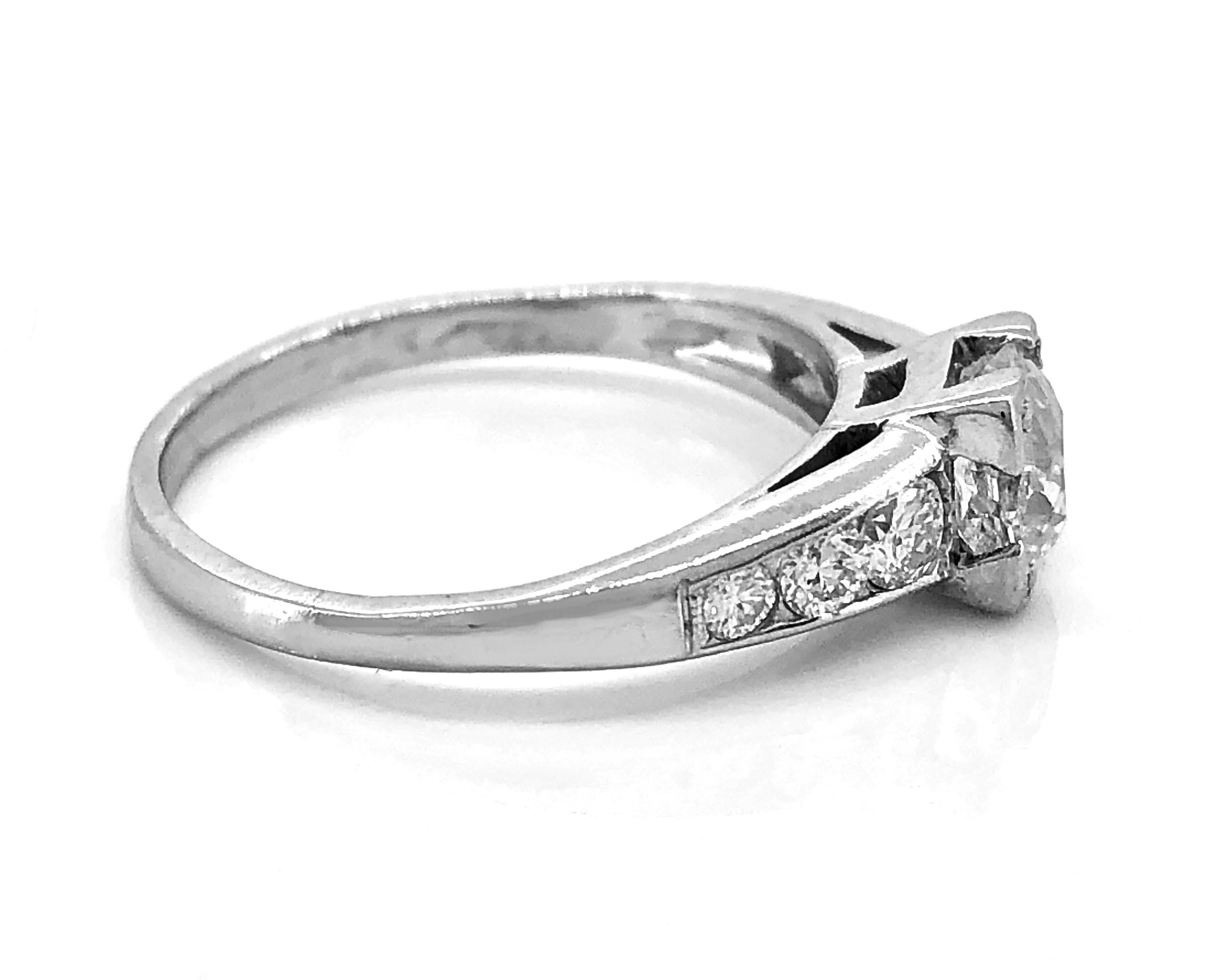 A traditional Art Deco diamond Antique engagement ring featuring a center European cut diamond weighing .43ct. Apx. with SI1 clarity and H color. The transitional cut diamonds on the shoulders weigh .20ct. Apx. T.W. with VS2-I1 clarity (eye clean)