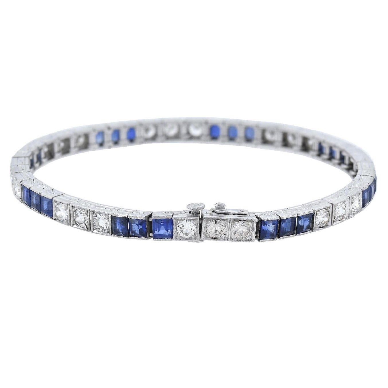 A gorgeous gemstone line bracelet from the Art Deco (ca1920s) era! Crafted in platinum, this fabulous piece features an alternating pattern comprised of sections of sapphires and diamonds. Each sparkling old European Cut diamond is micro-prong set