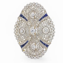 Spilla Art Deco in oro giallo 18k platino con diamante e zaffiro da 4,70 carati