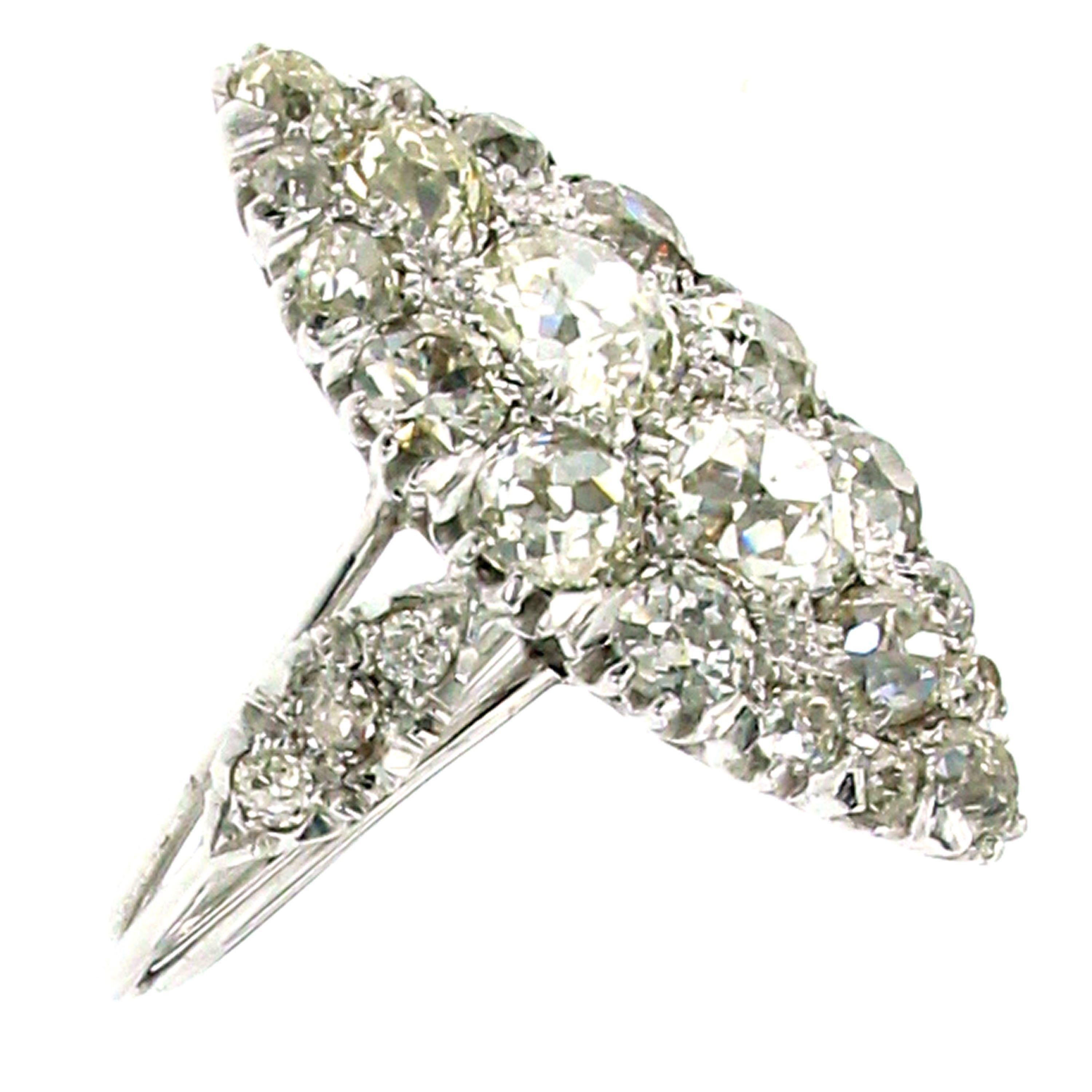 An Antique Art Deco Platinum Diamond Ring featuring 26 Old mine cut Diamonds for a total weight of 5 carats, graded H/I color VS clarity.
Hand-crafted in Platinum during Art Deco era.

CONDITION: Pre-Owned - Excellent
METAL: Platinum
GEM STONE: