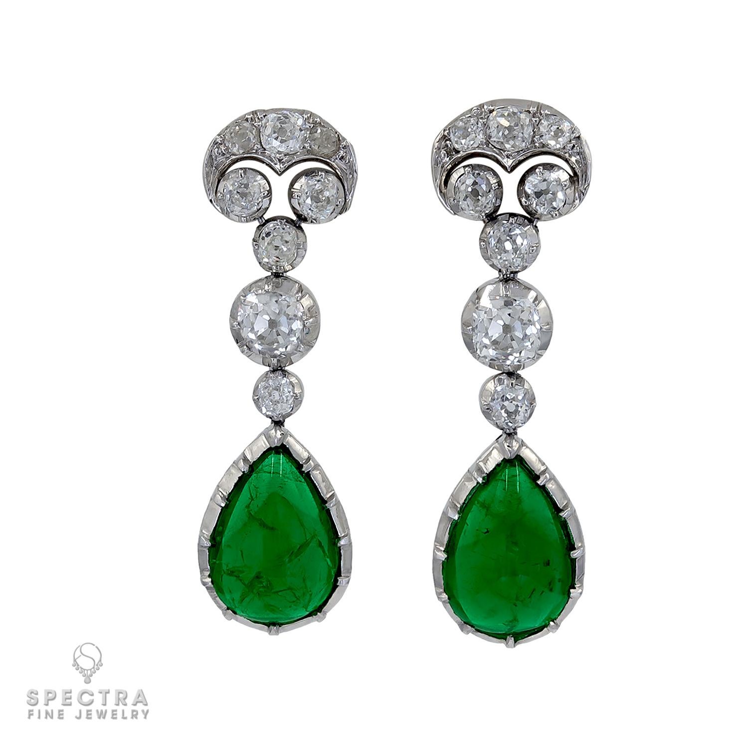 These Vintage Art Deco Diamond Emerald Drop Earrings, made during the Art Deco Era, have all the allure of a time past. The design is rooted in Georgian and Victorian jewelry but was brought into the Deco period (approx. 1919-1939). The focal point
