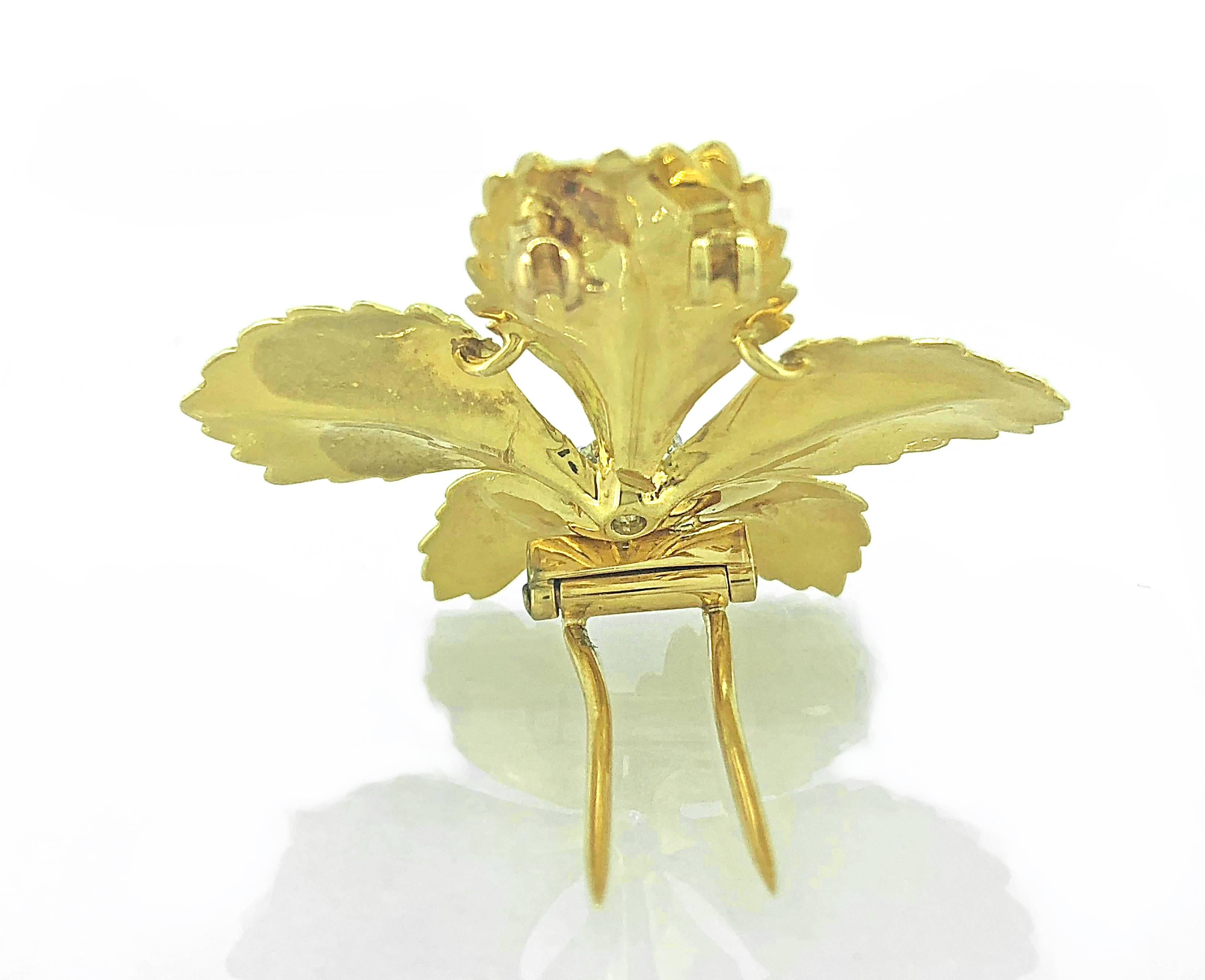 An absolutely stunning figleaf antique brooch crafted in 18K Yellow Gold featuring a .50ct. apx. European cut diamond. This brooch is of incredible high quality from the well known maker Cartier. Extraordinary workmanship shows off the fine details.