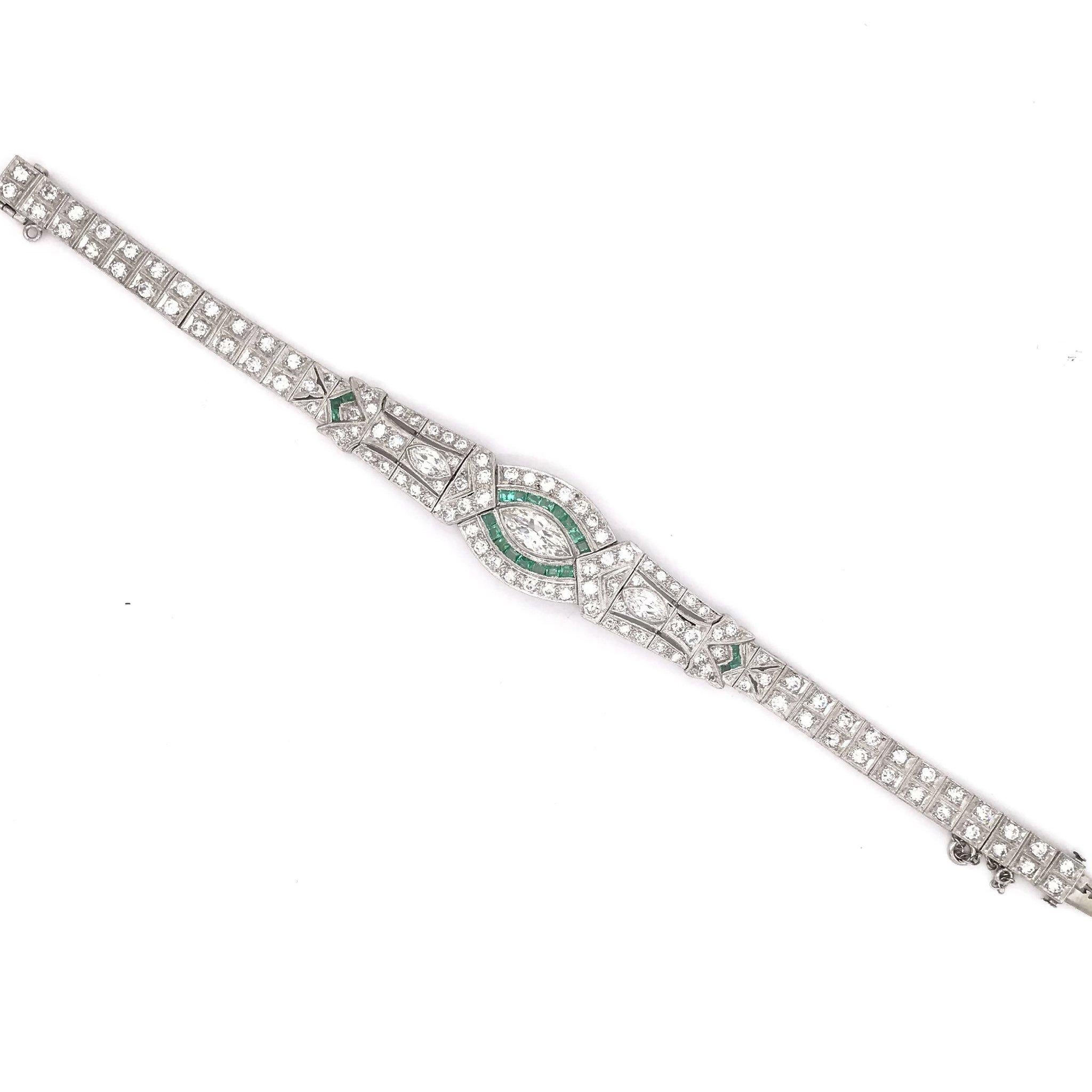 An absolutely stunning antique piece, this platinum bracelet was skillfully handcrafted sometime during the Art Deco design period ( 1920-1940 ). The bracelet setting is platinum and features an impressive 139 gemstones in total. The center diamond