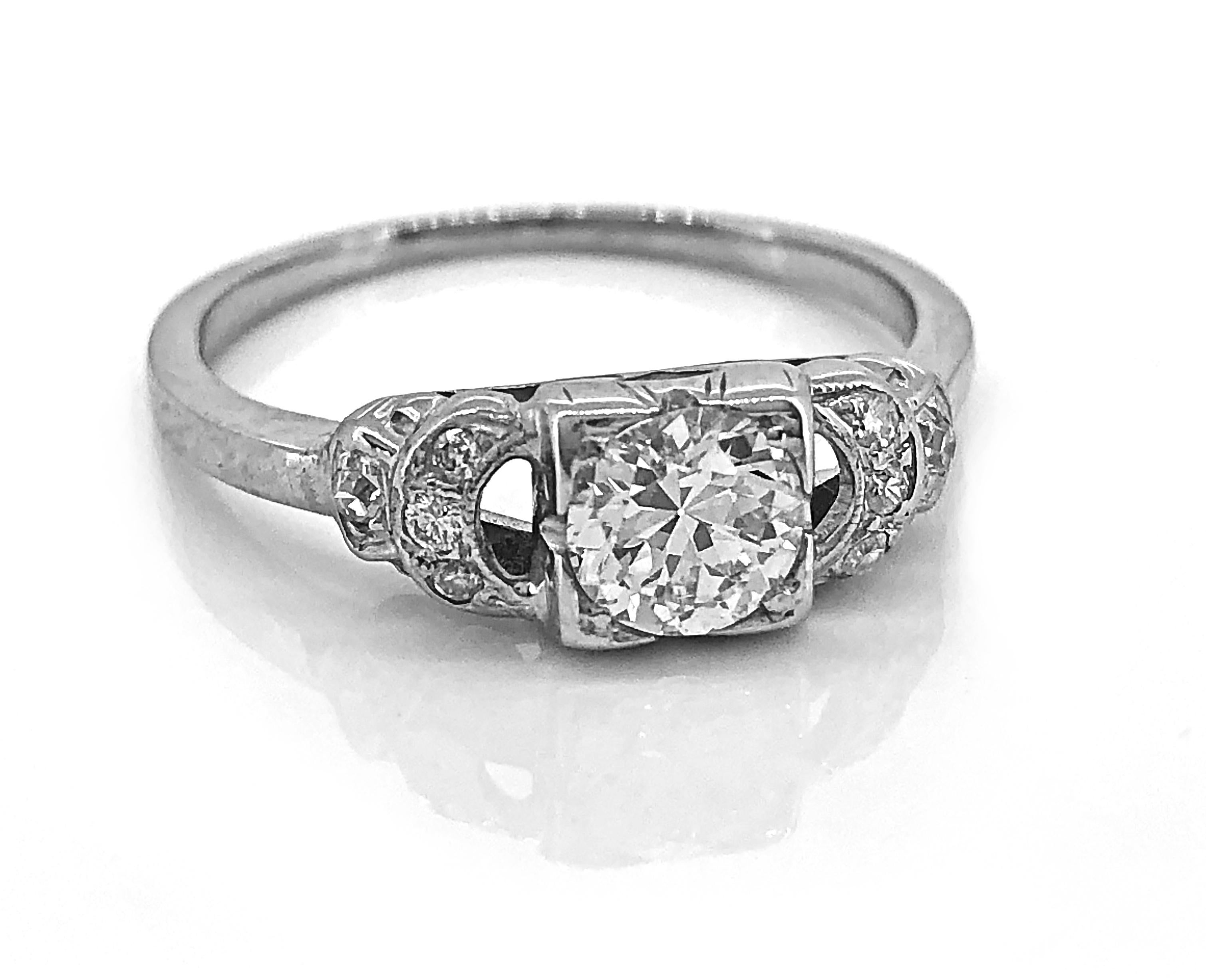 This Art Deco diamond antique engagement ring is crafted in 14K white gold. This ring features a .50ct. apx. diamond with VS2-SI1 clarity and G-H color. The center diamond is accompanied by .05ct. apx. T.W. of diamond melee. The ring is beautifully