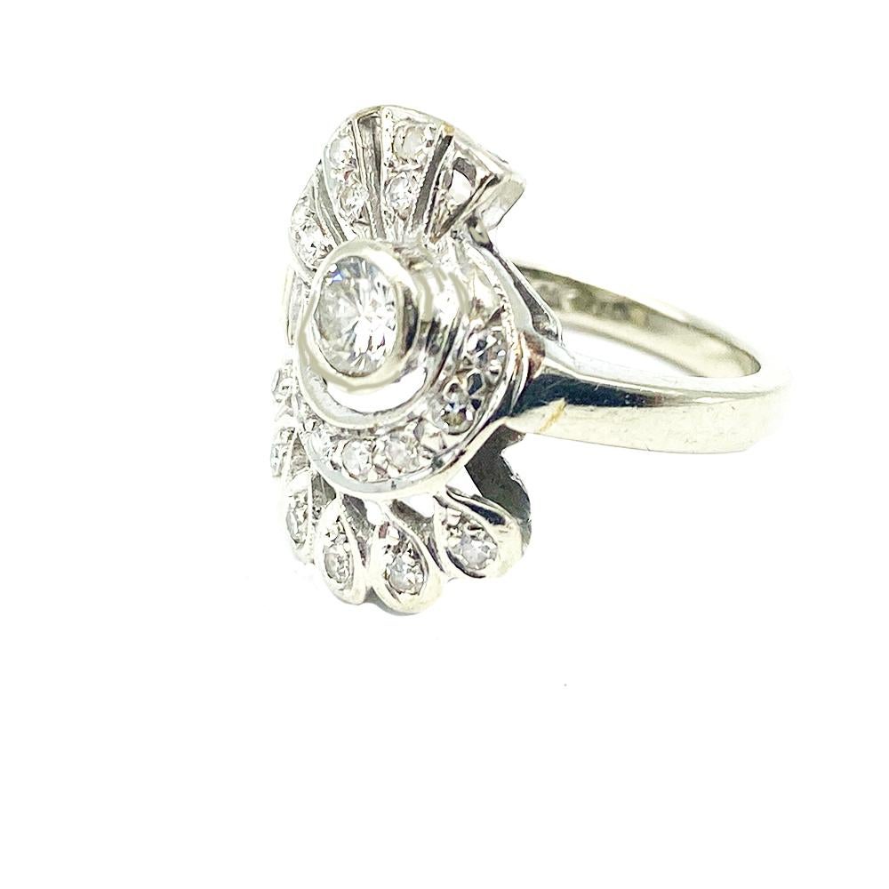 Art Deco European Diamond Ring is styled in a Fan Shape. The center features a quality round European cut diamond measuring 4.40 mm. The diamond weight is estimated at .25 carat. Quality is VS clarity and G-H color.
The ring is set with 19- round