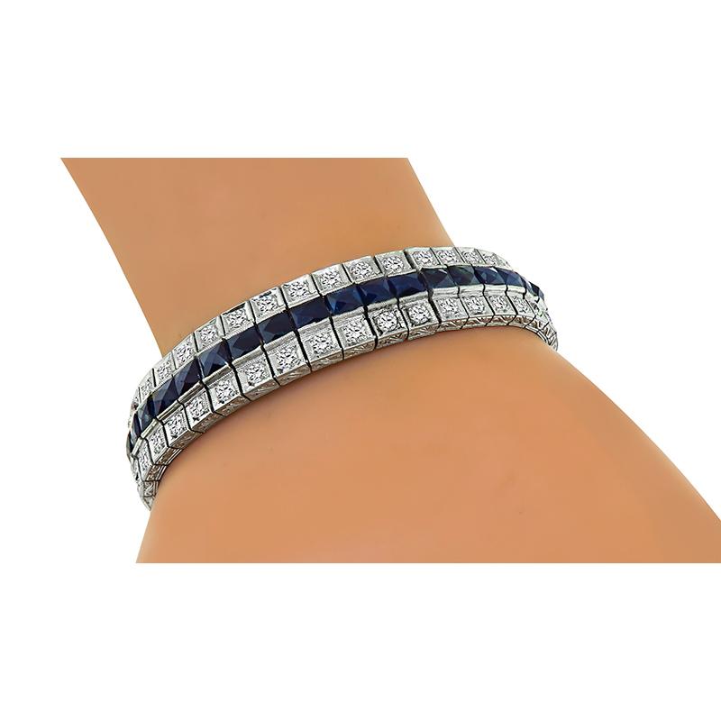 This is an amazing platinum bracelet from the Art Deco era. The bracelet features lovely French cut sapphires that weigh approximately 18.00ct. The sapphires are accentuated by sparkling old European cut diamonds that weigh approximately 5.00ct. The