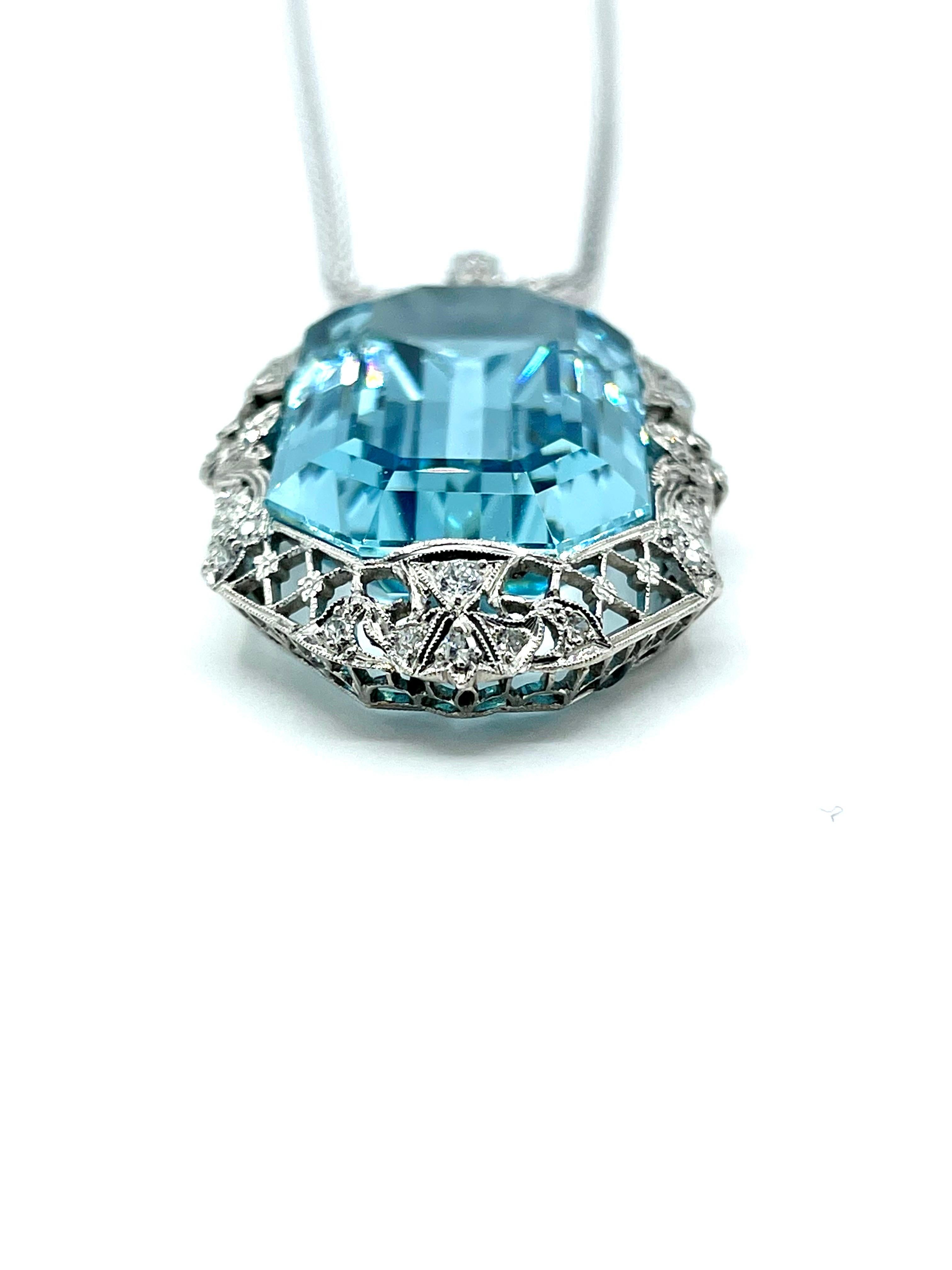 An absolutely stunning Art Deco Aquamarine pendant!  The 51.88 carat emerald cut Aquamarine has amazing brilliance and color.  It is set in a prong set filigree Art Deco mounting containing old European cut and single cut diamonds weighing 1.00