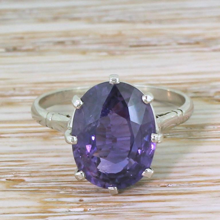 A ring of fine, stripped back beauty. The oval cut natural sapphire – certified as unheated and untreated – is predominantly purple, with strong flashes of blue when exposed to incandescent light. The stone is secured in gorgeous platinum mount,