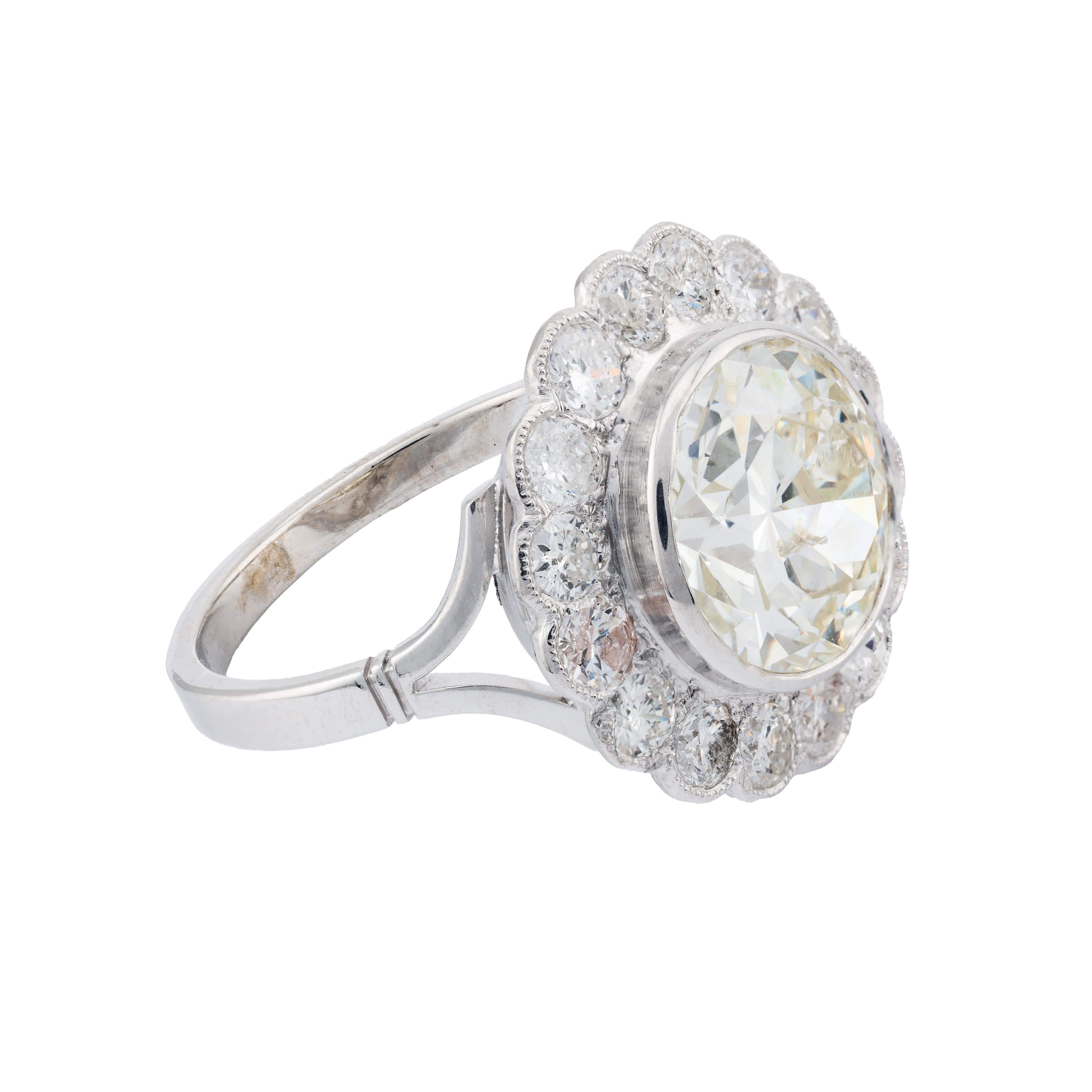 Aston Estate Jewelry Presents:

An exquisite engagement ring from 1920. Crafted in platinum, this piece features a captivating 4.03 carat European cut diamond, graded I color and SI2 clarity.

The central diamond is elegantly framed by 1.28 carats