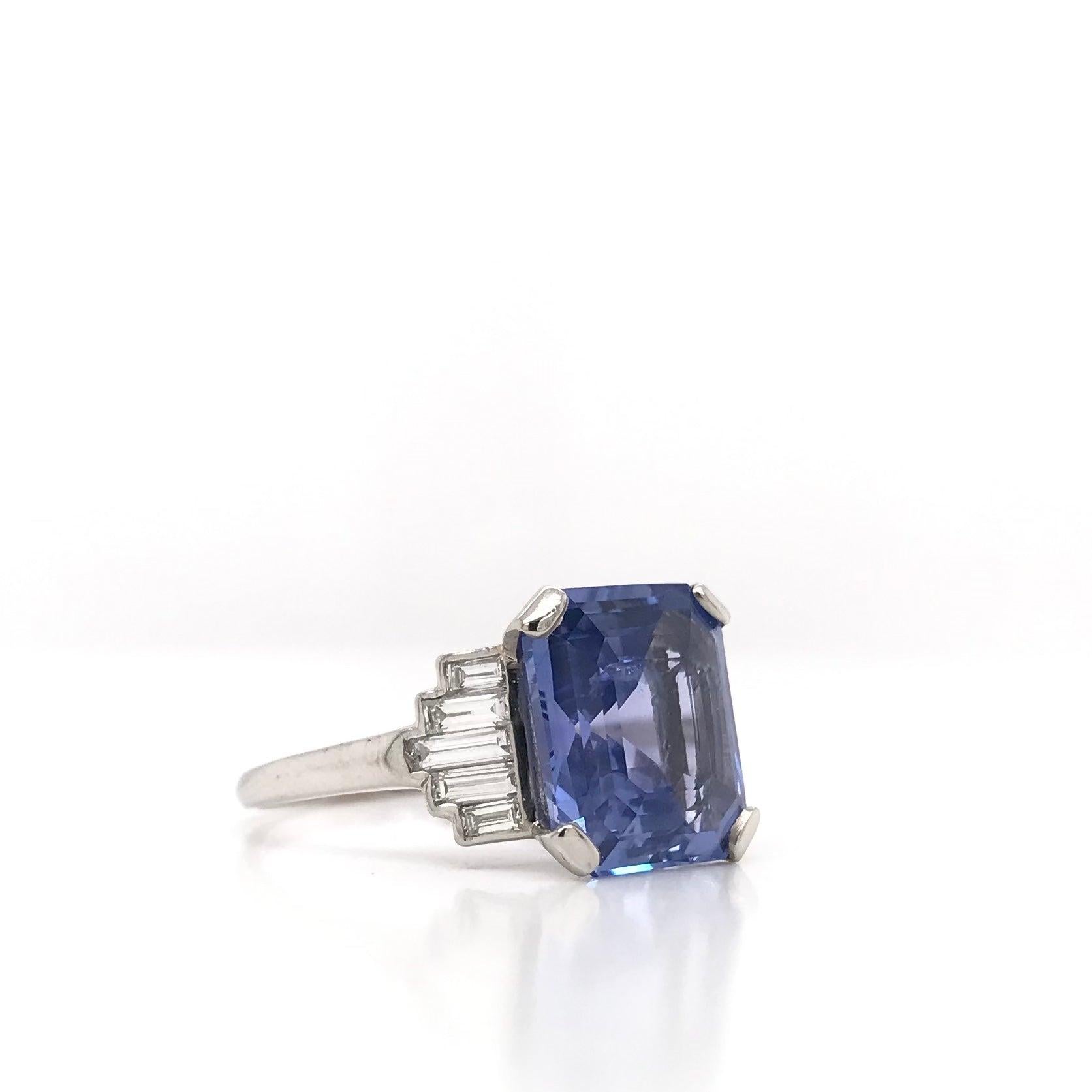This stunning antique piece was handcrafted sometime during the Art Deco design period ( 1920-1940 ). The center stone is an incredible unheated Ceylon sapphire. The sapphire is a fancy cut measuring approximately 5.63 carats. Ceylon sapphires