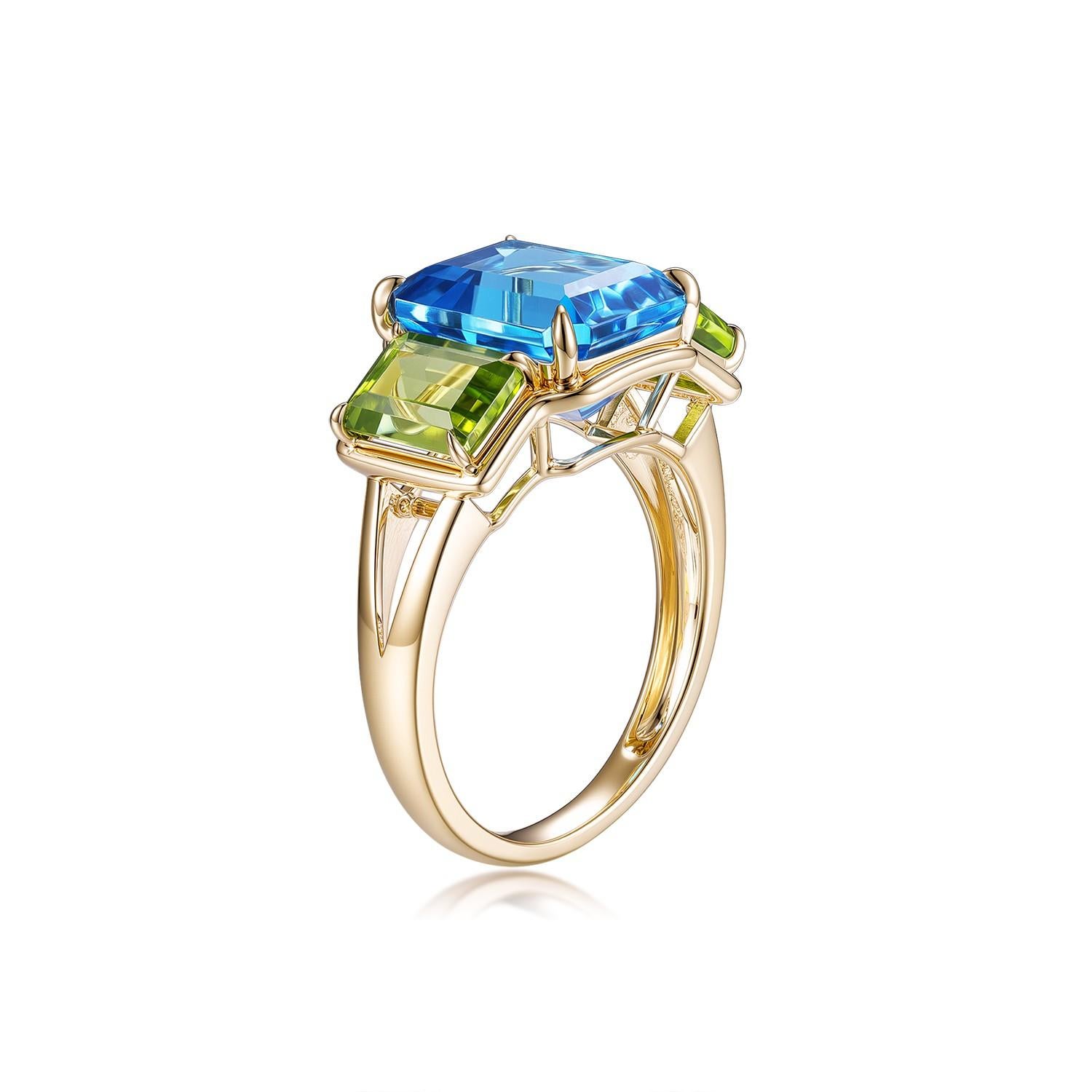 Erhöhen Sie Ihren Stil mit diesem atemberaubenden Ring aus 14 Karat Gelbgold, der mit einer faszinierenden Mischung aus Edelsteinen aufwartet. Das Herzstück ist ein strahlender Schweizer Blautopas im Smaragdschliff mit einem Gewicht von 5,63 Karat,
