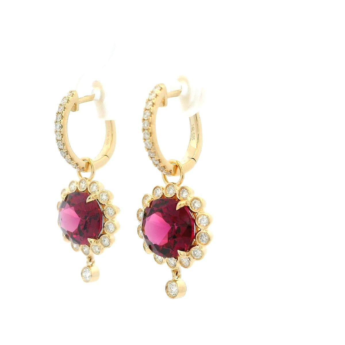 Celebrate timeless beauty with these enchanting 14K yellow gold dangle earrings.  Featuring 5.68 carats of rich, deep-red garnets, each gemstone is surrounded by a halo of sparkling diamonds totaling 0.64 carats.  The delicate floral-inspired