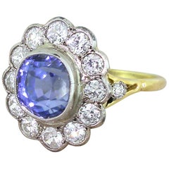 Art Deco 5.76 Carat Natural Ceylon Sapphire and Old Cut Diamond Cluster Ring